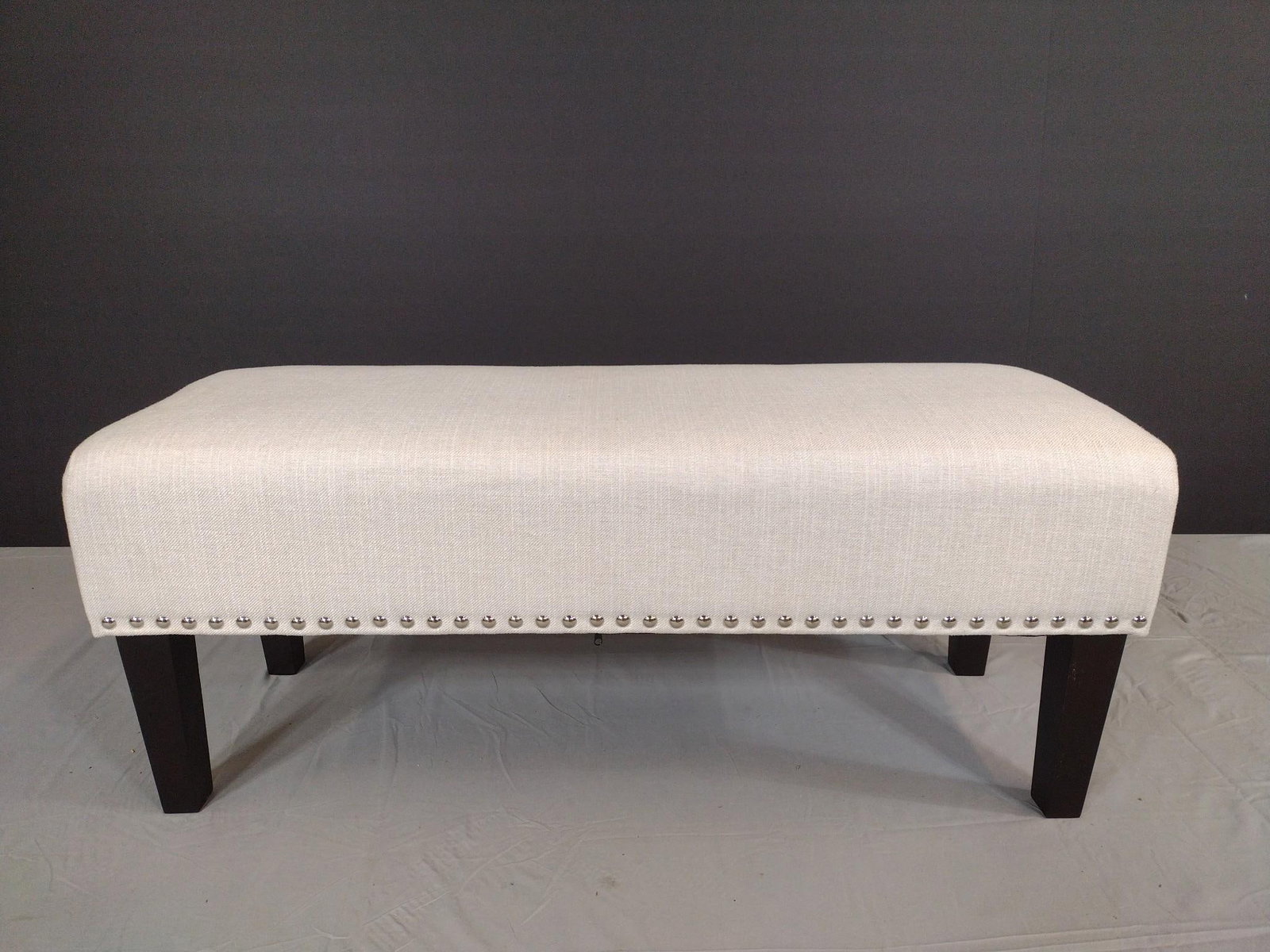 Ashley Furniture Accent Bench with Stud Boarder: NOT ELIGIBLE FOR IN-HOUSE SHIPPING. 44" wide X 16" deep X 17-1/2" high. MG.