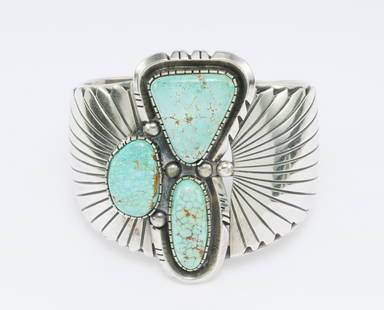 Large Navajo Cuff Bracelet Sterling Silver And Turquoise: DESCRIPTION: Beautiful pale spiderweb turquoise stones in this cuff bracelet by Wilson Padilla. MEASUREMENTS: 2 5/16" horizontal inner diameter, 1 3/16" opening, 2 1/2" width. Weight 112 grams (3.6