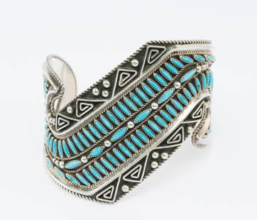 Sterling Silver Navajo Cuff Bracelet: DESCRIPTION: A needlepoint design turquoise and silver cuff by Betty Betoney. MEASUREMENTS: 2 1/2" inner horizontal diameter, 1 5/8" opening, 2 3/4" width. Weight 98.7 grams (3.2 Troy ounces).