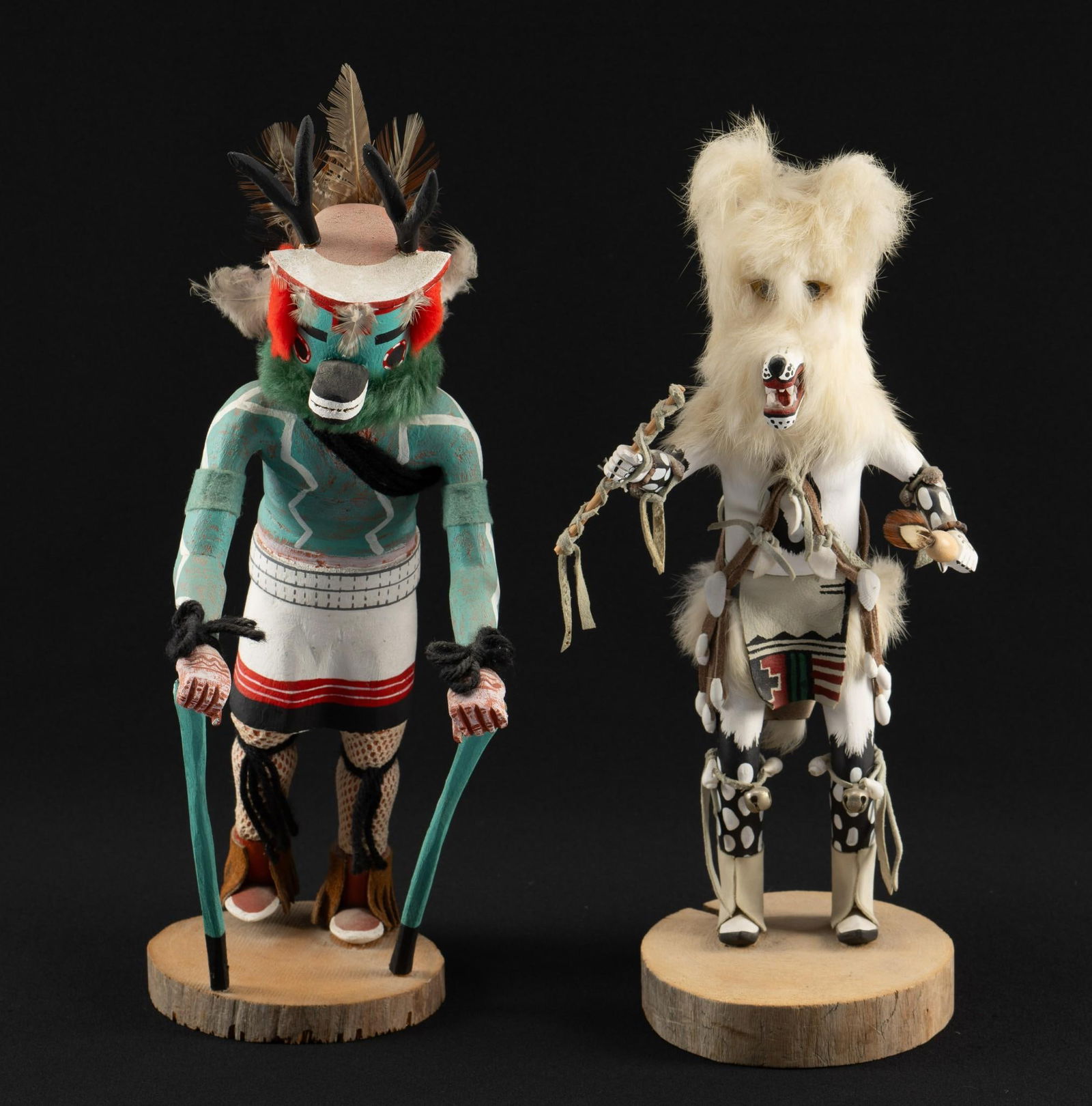 2 Kachina Dolls: DESCRIPTION: Includes Antelope and Wolf. Wolf is signed Raymond Parliett. Kachina dolls are representations of the Katsina spirits. The carved figures are gien as ceremonial gifts to young girls by Ka