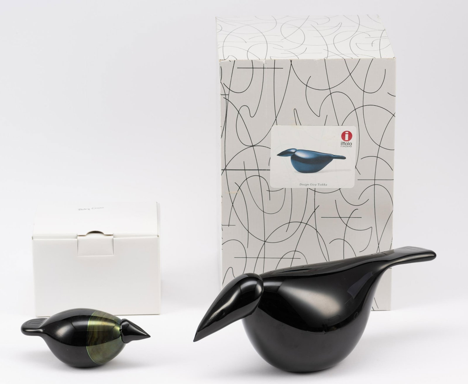 Oiva Toikka Korppi Raven And Baby Crow: DESCRIPTION: Raven is Signed and with original box identified on the box "Korppi - Raven". Baby crow, signed. MEASUREMENTS: Raven measures 11 1/2" length, 4 1/2" height, 4 1/4" width. Baby Crow measur