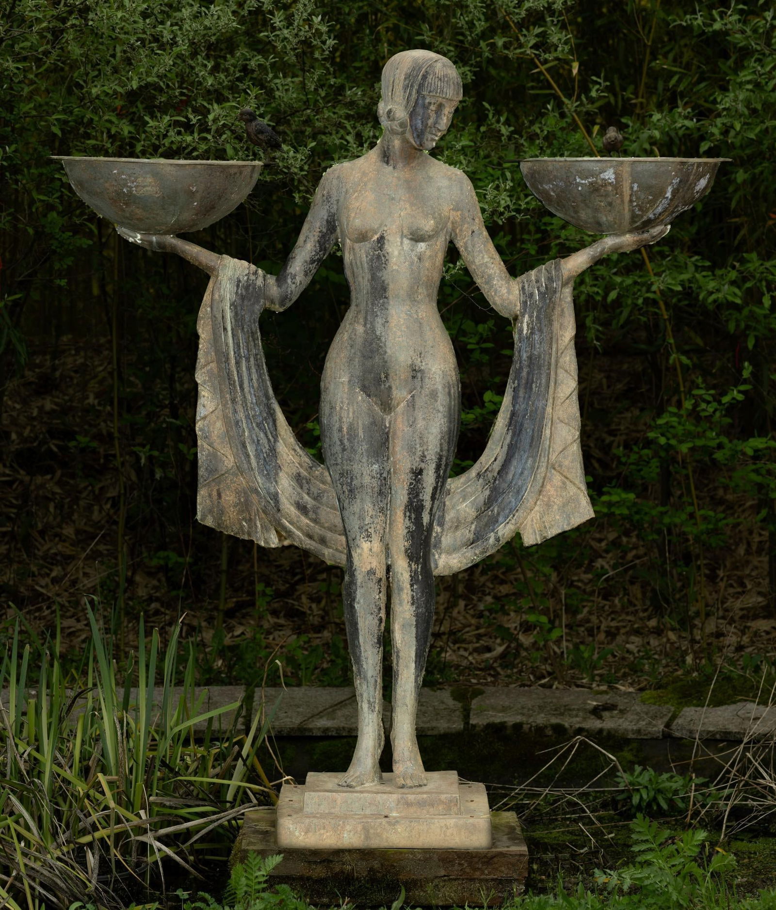 Bronze Art Deco Fountain: NOT ELIGIBLE FOR IN-HOUSE SHIPPING. DESCRIPTION: Female nude holding two bowls with birds sitting. Fabric draped behind her hanging off arms. Birds mouths are the water source for fountain. The sculpt