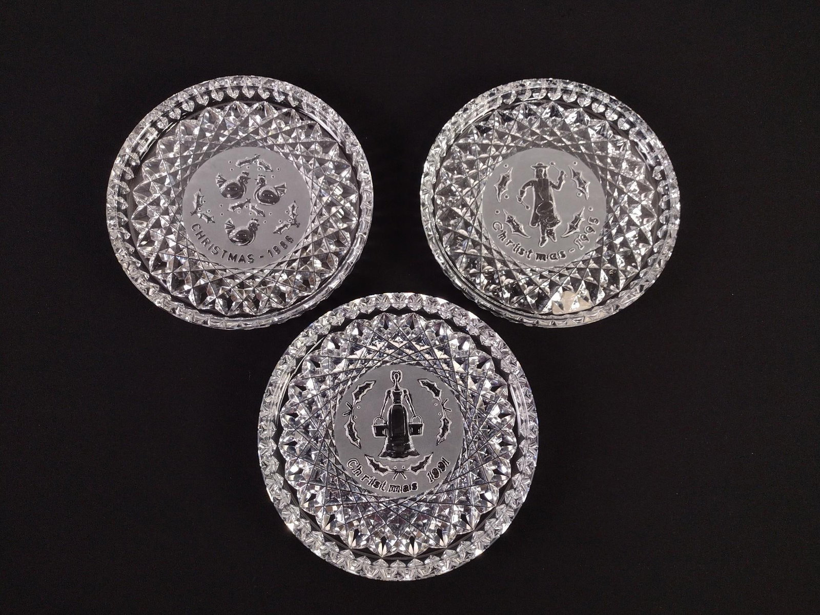 3 Waterford Christmas Plates with OB's: Includes 1986, 1991, 1995. Each 8" diameter. Original boxes with some wear.