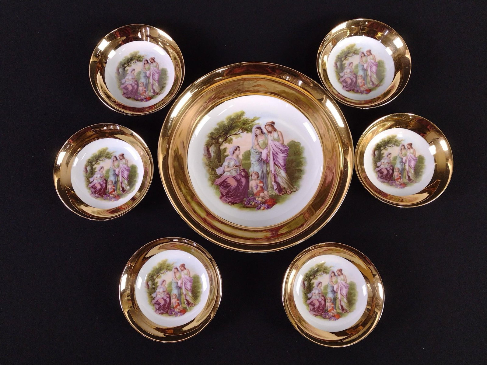 7 Pcs Czechoslovakian Portrait Painted Bowl Set: Includes serving bowl and 6 small bowls. 5" to 10" diameter x 1-1/4" to 2-1/2" high. Some paint losses.