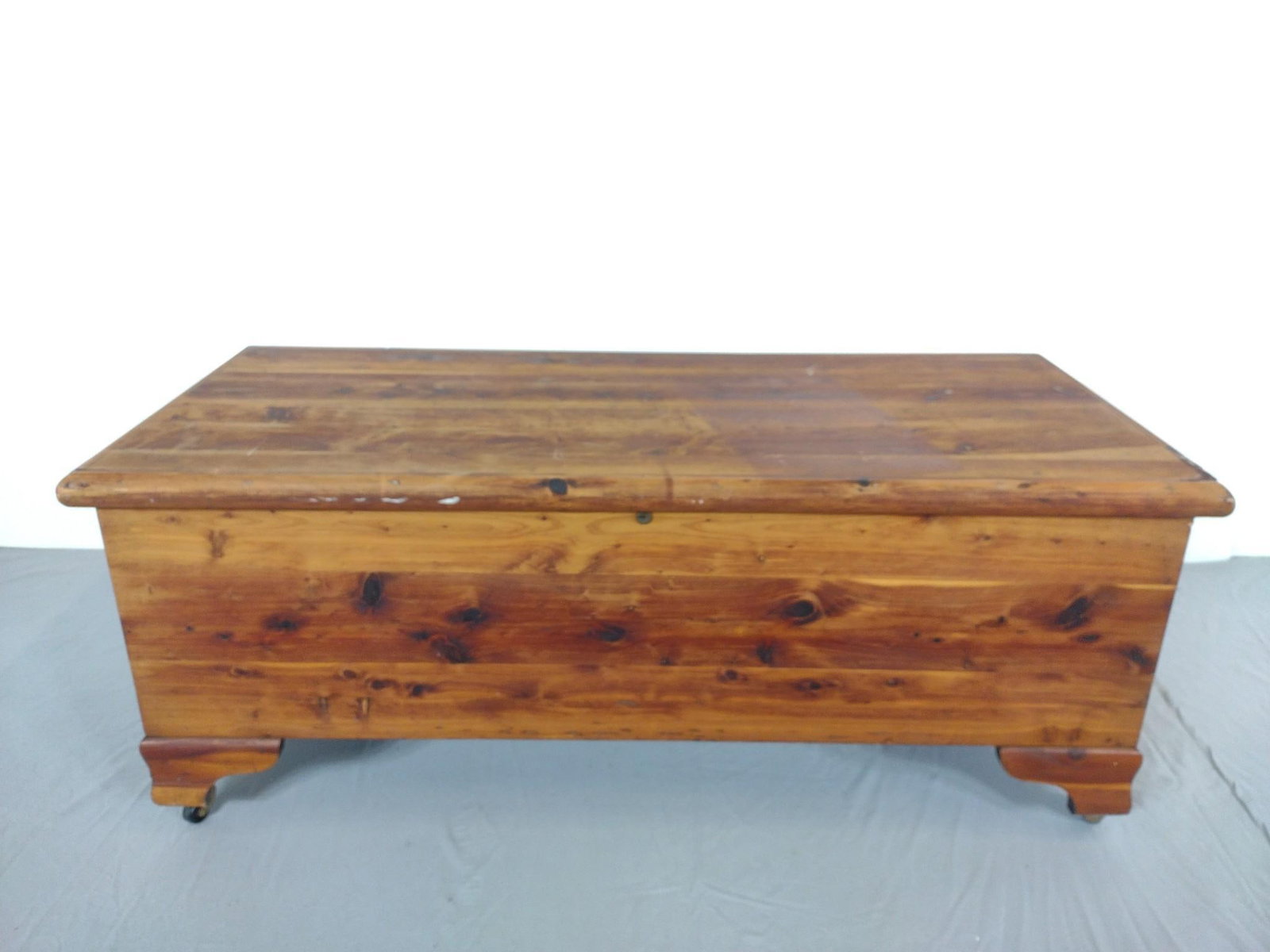 Stewart Cedar Chest: NOT ELIGIBLE FOR IN-HOUSE SHIPPING. 45-1/2" wide X 19-1/2" deep X 18-1/4" high. Has some light scratches. Trim on right side has loss. Has some discoloration to the top.