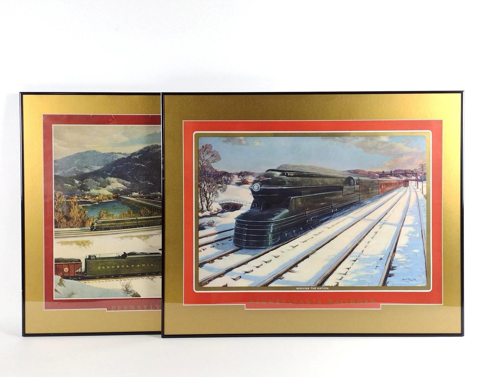 2 Pennsylvania Railroad Prints incl "Serving The Nation": NOT ELIGIBLE FOR IN-HOUSE SHIPPING. Sight: 19-1/2" to 20-1/2" high x 26-1/2" wide. Overall with frame: 25-1/4" high x 31-1/4" wide. Some wrinkling, tears and losses to prints.