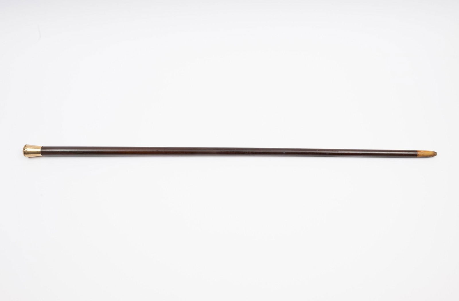 Walking Stick with 14K Gold Cap and Bone Tip: NOT ELIGIBLE FOR IN-HOUSE SHIPPING. 35-1/4" long. Some dents to gold. Some losses to tip.