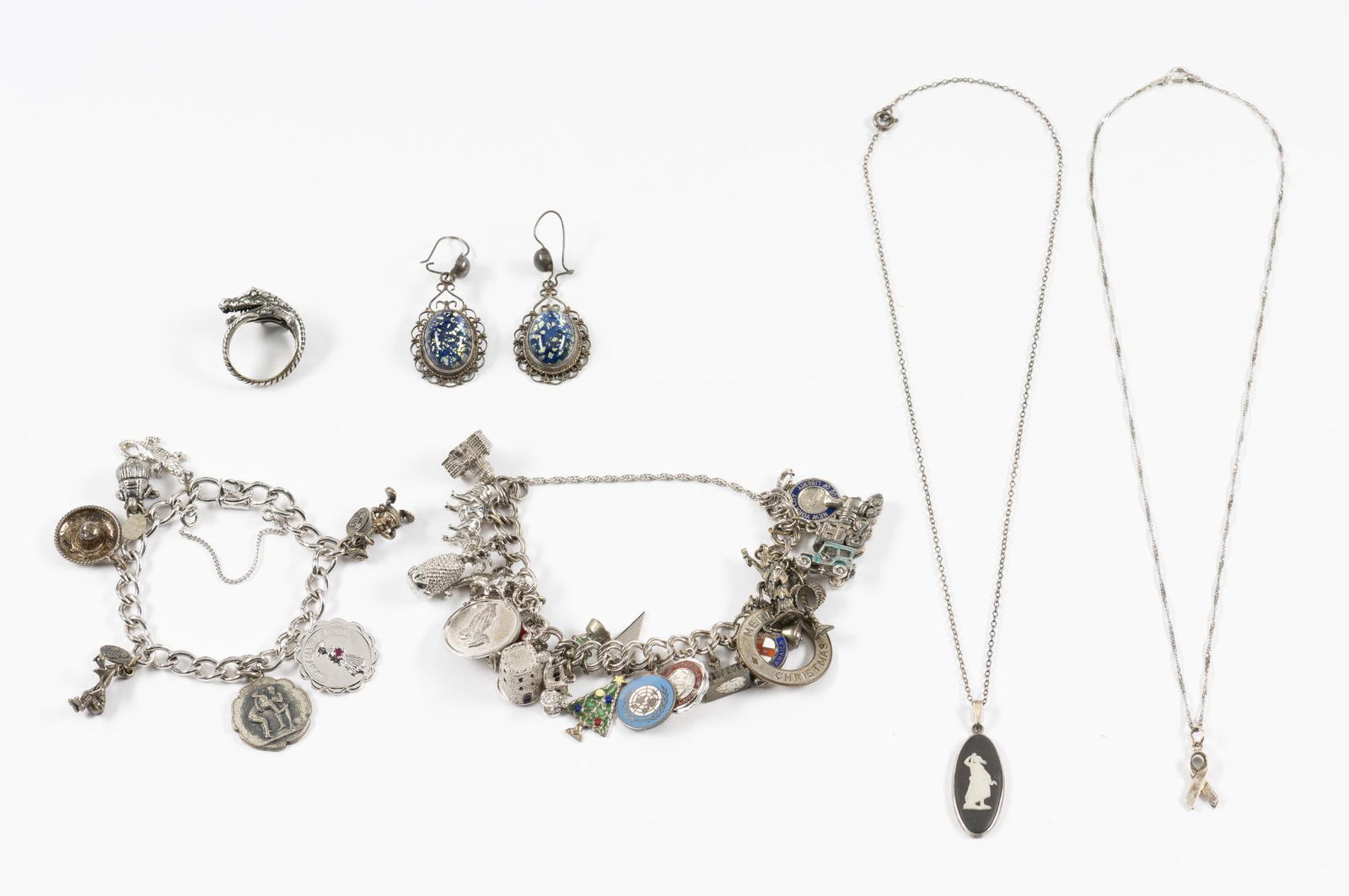 6 Pcs Sterling Jewelry Incl Charm Bracelets: Two charm bracelets, a baby alligator ring, chain necklaces, tie pin. Total weight 4.9 troy ounces. Some charms are not sterling.