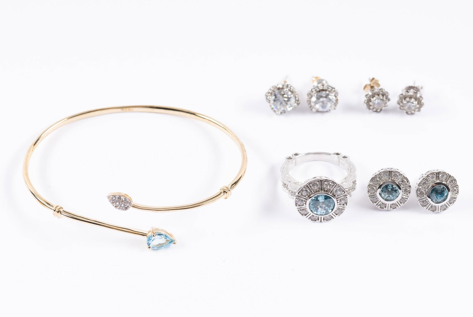 8 Pcs. Sterling Jewelry: Includes 3 pairs pierced earrings, bracelet, and ring. Ring size 9, 3/4" long. Bracelet 2-3/4" inside diameter. Earrings measure 3/8" to 5/8" diameter.