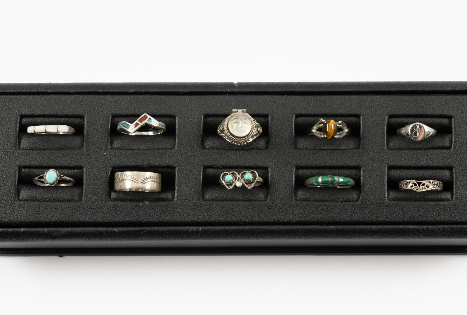 10 Sterling Rings: Includes carved moonstone poison ring, tiger's eye, turquoise, and mother of pearl. Sizes 4 to 8.