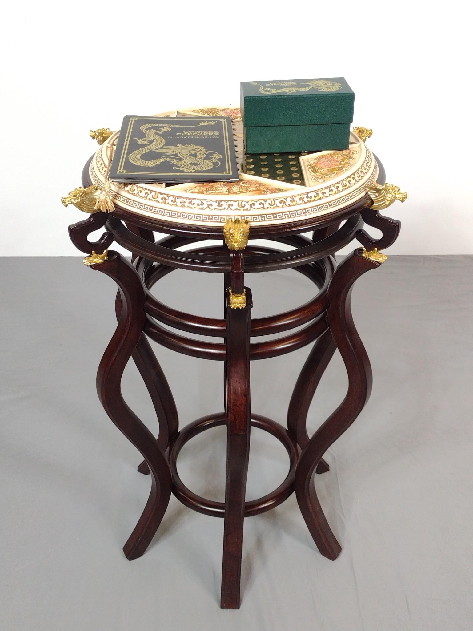 Chinese Checkers On Stand: NOT ELIGIBLE FOR IN-HOUSE SHIPPING. 19-1/2" diameter X 28-1/2" high. Includes gemstone pieces and book.
