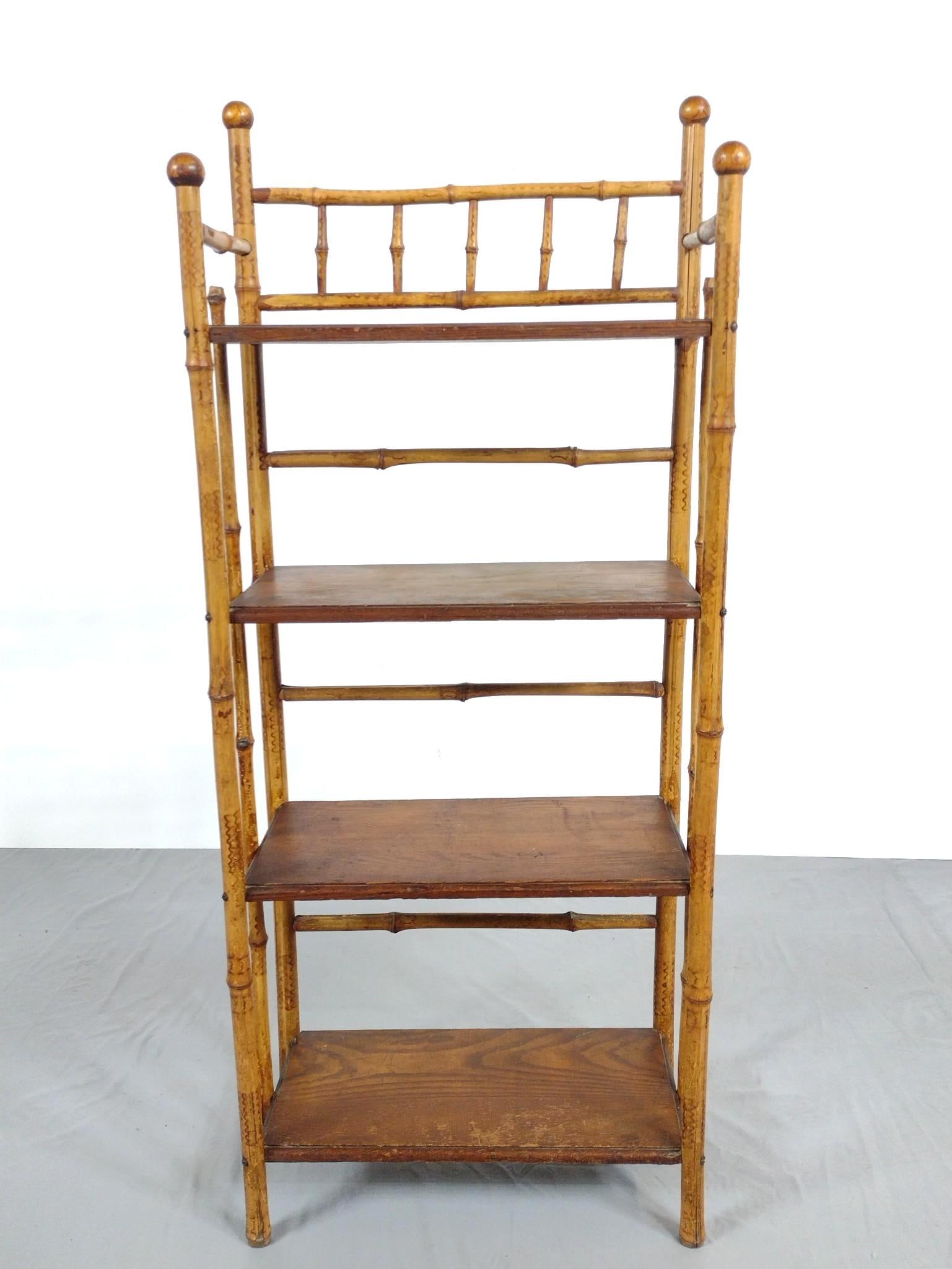 Bamboo Bookcase: NOT ELIGIBLE FOR IN-HOUSE SHIPPING. 19" wide X 10-1/2" deep X 46" high. Missing two ball finials on sides. Has some scratches and areas of discoloring.