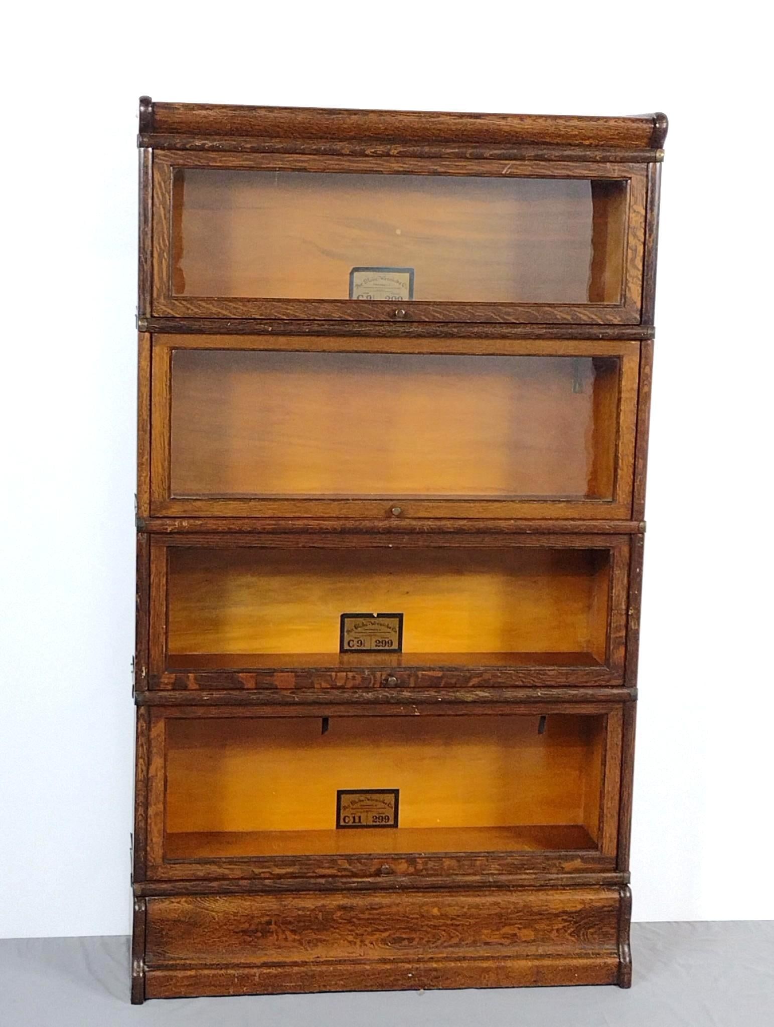 The Globe-Wenicke Co Barrister Bookcase: NOT ELIGIBLE FOR IN-HOUSE SHIPPING. 34" wide X 10-1/2" deep X 59-1/2" high. Has some scratches. Two sections are missing glass. One has cracked glass.