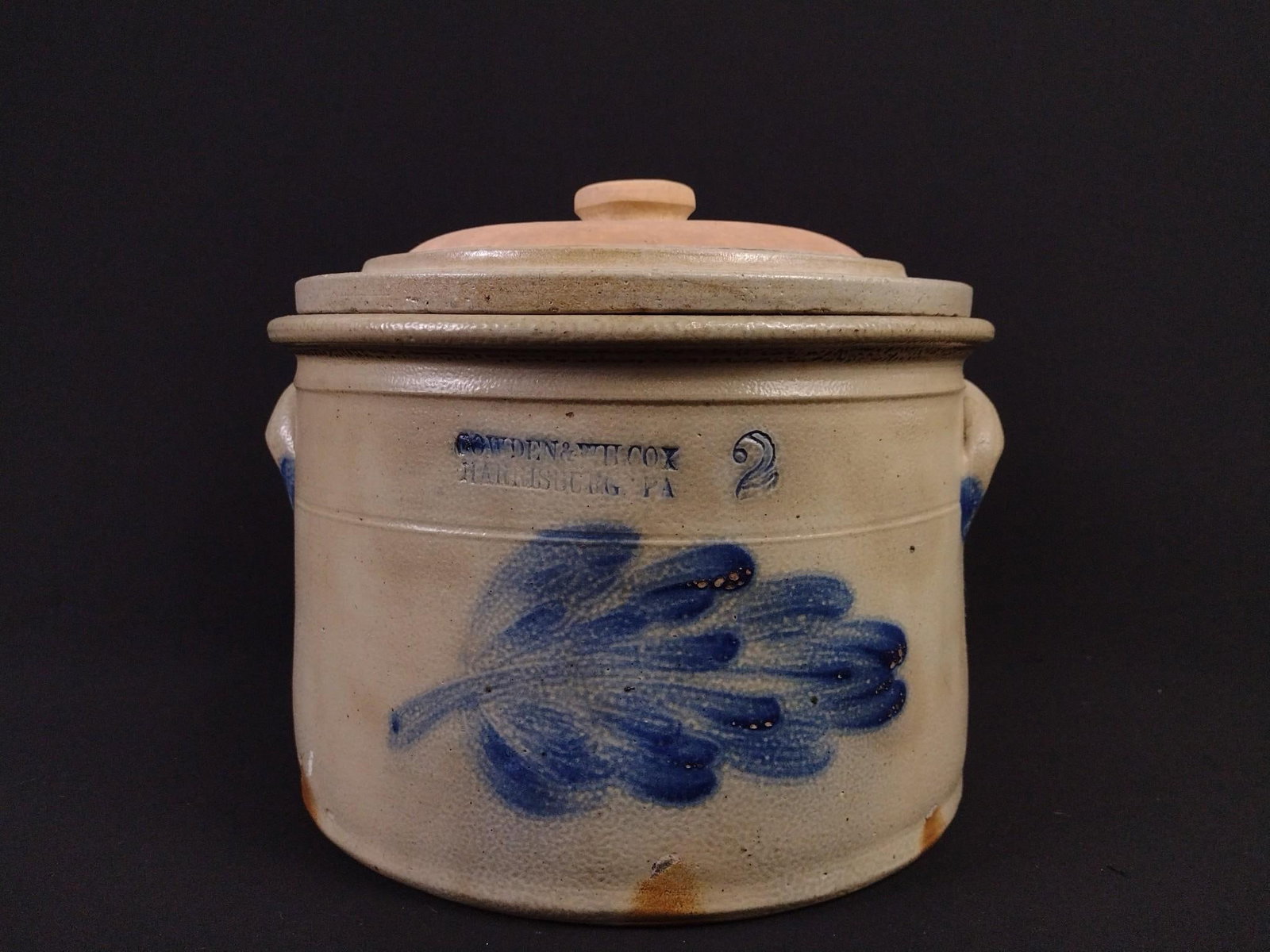 2 Gallon Cowden and Wilcox Crock with Lid: Lid appears to be a marriage. Overall 11" diameter x 10" high. Minor crack and loss to lid.