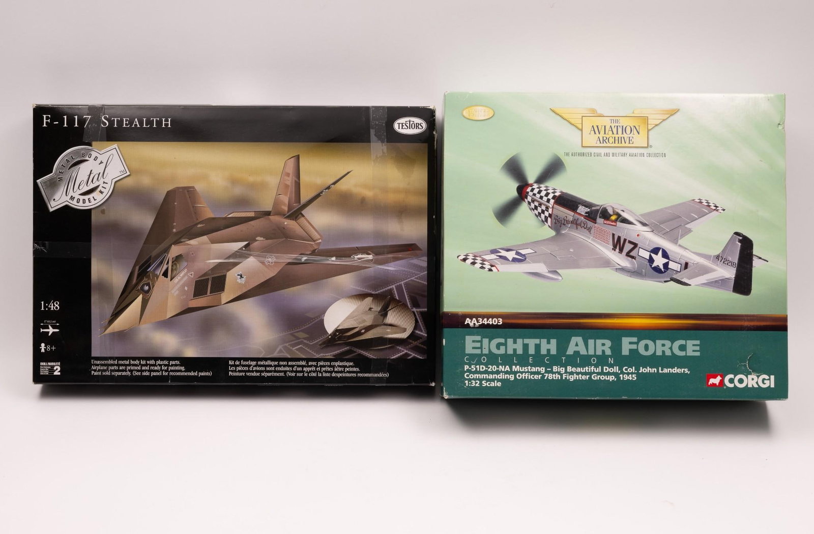 Corgi 8th Air Force and Testors F-117 Stealth Models: Both appear to be un-assembled in original boxes. Both boxes with some wear. Testors box with tape to exterior.