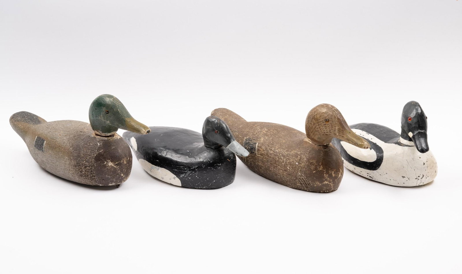 4 Duck Decoys incl Lead Weighted: All unsigned. 5-3/4" to 7-1/2" high. Necks detach. Some paint losses.