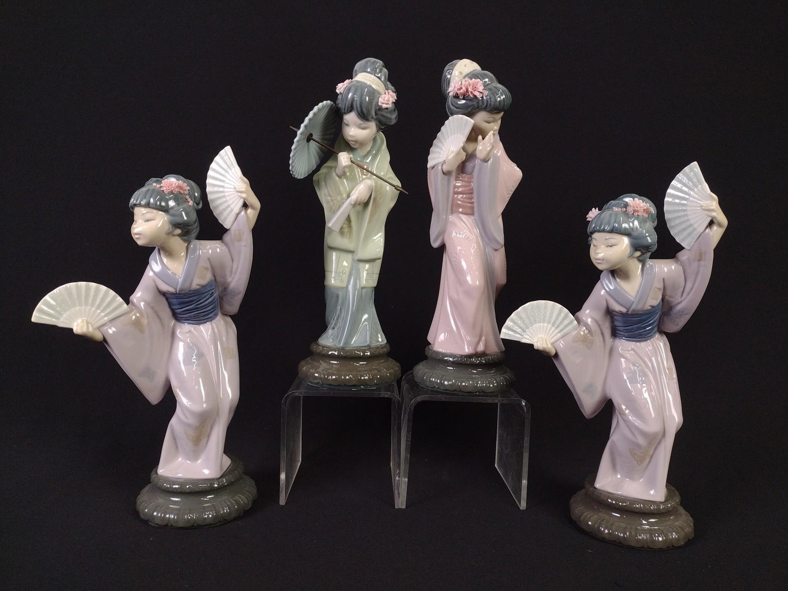 5 Lladro Figures: 11-1/4" to 12" high. One figurine with purple dress repaired.
