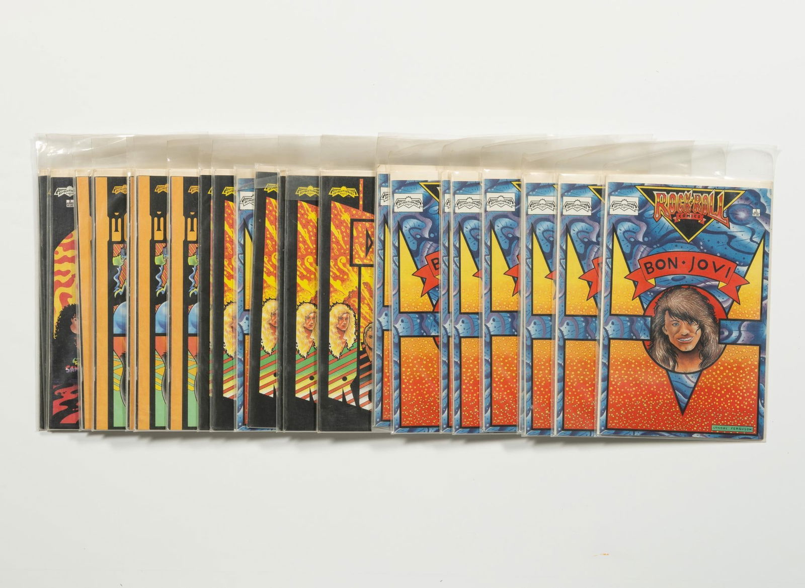 25 Revolutionary Comics, Rock N' Roll Comics: Multiple copies each Bon Jovi; Def Leppard; Metallica; and Motley Crue. Average condition VF.