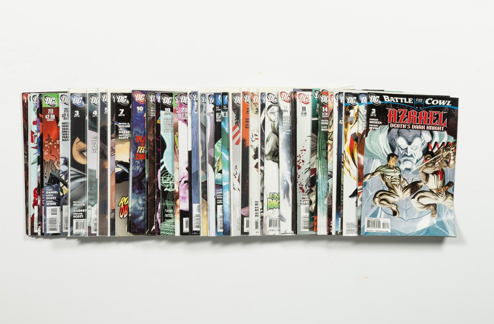 Approx. 40 Misc. DC Comics: Titles include Azrael; Batgirl; Batman; and others. Includes #1s. Average condition VF.