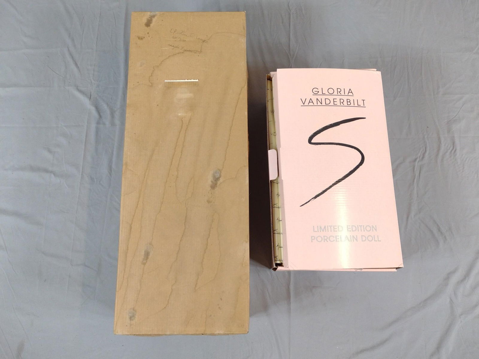 2 Dolls incl Christine Orange and Gloria Vanderbilt: NOT ELIGIBLE FOR IN-HOUSE SHIPPING. Christine Orange doll edition number 215 / 1000. Gloria Vanderbilt doll "Gloria as a Baby" with COA. 18" to 32" high.