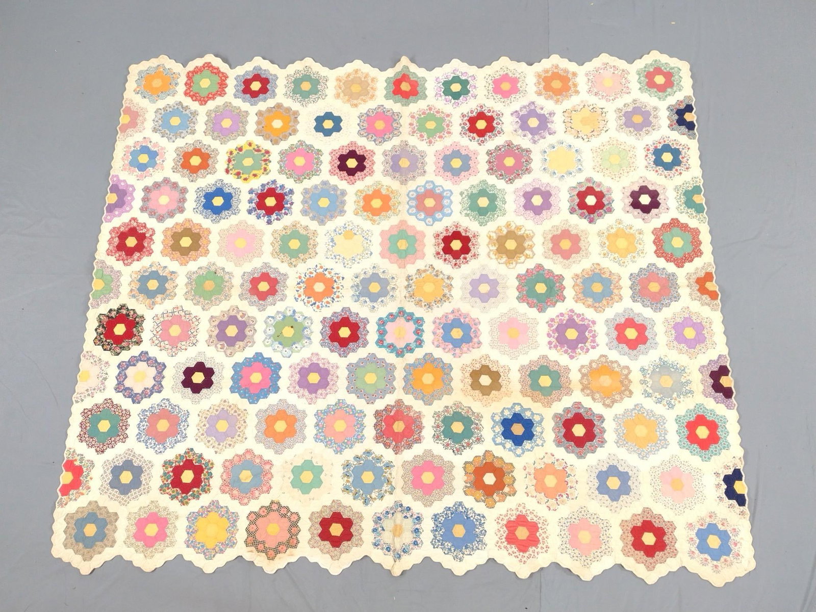 Vintage Patchwork Quilt: Some staining and discoloration. 6'3" wide X 7'2" long.