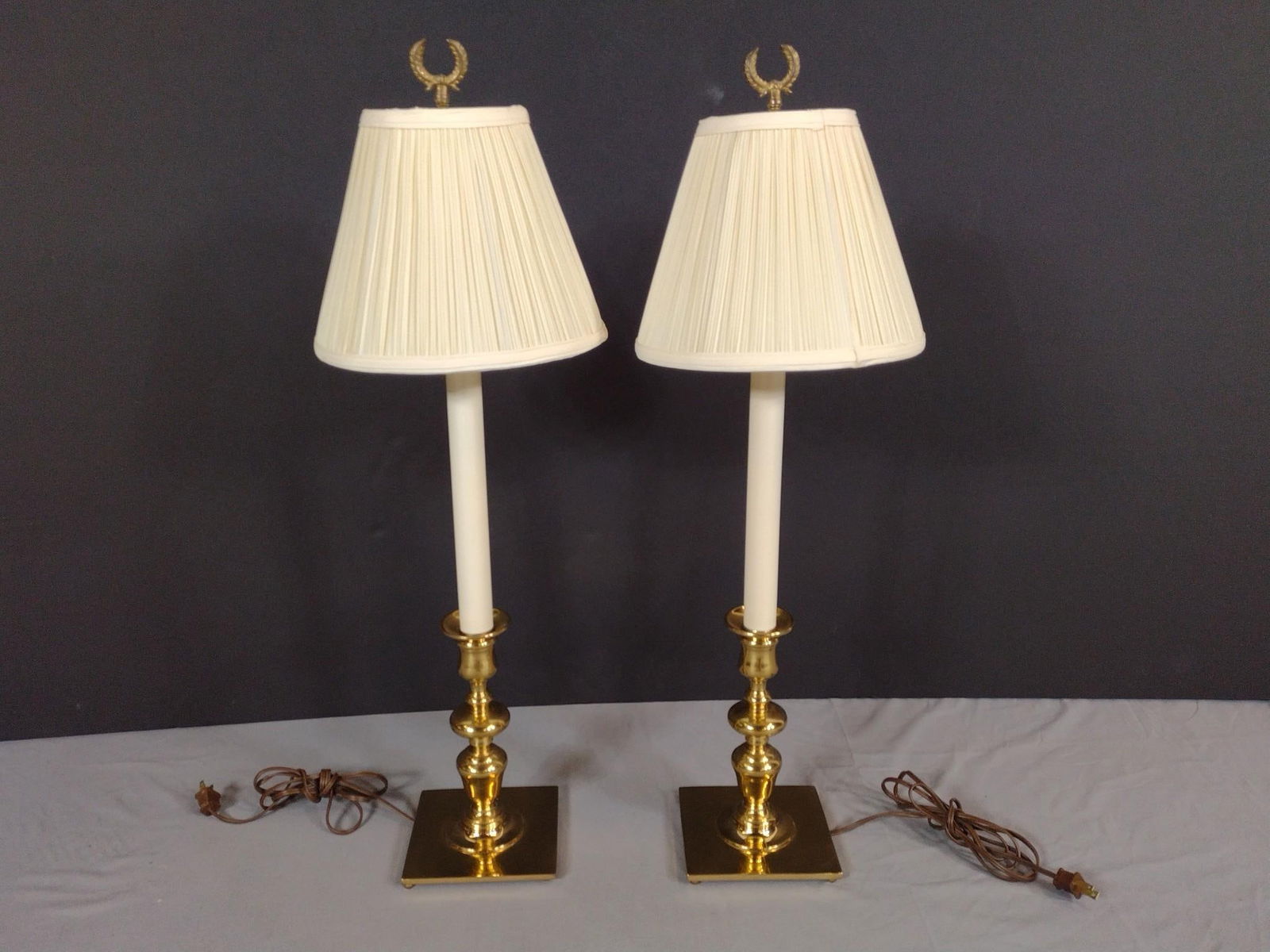 2 Brass Candlestick Style Table Lamps: NOT ELIGIBLE FOR IN-HOUSE SHIPPING. Working. Each overall with shade: 10" diameter x 31" high.