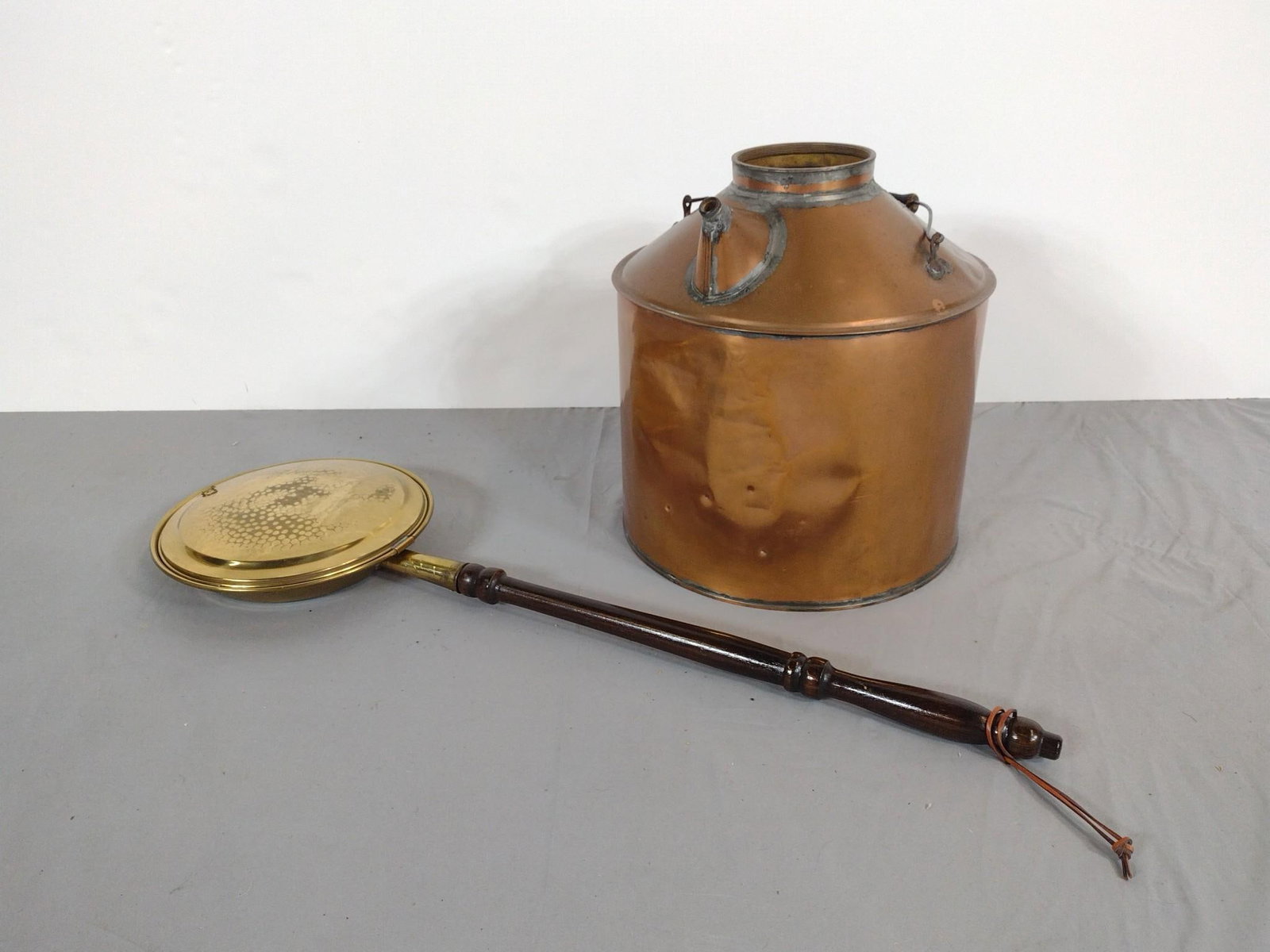 Brass Bed Warmer and Copper Vessel: NOT ELIGIBLE FOR IN-HOUSE SHIPPING. Bed warmer: 34" long. Copper vessel: 14" wide x 15" deep x 16" high.
