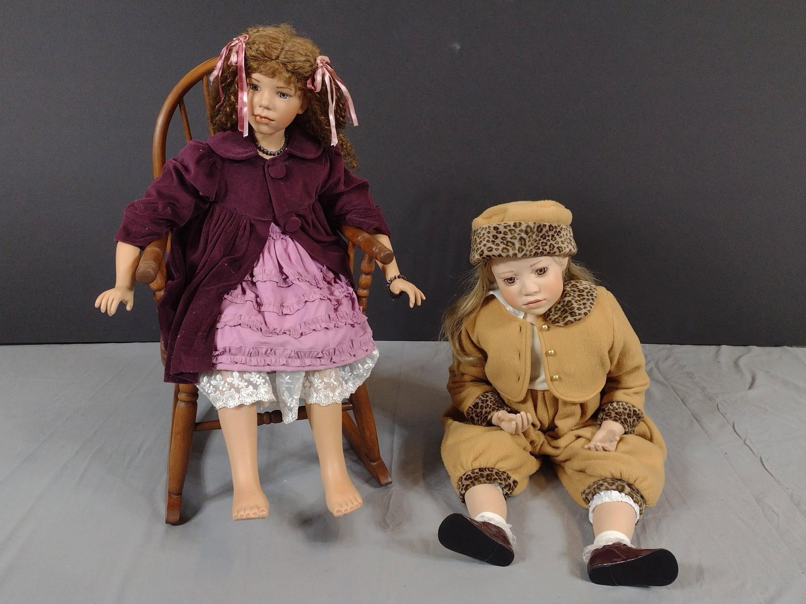 2 Vintage Dolls incl Christine Orange and Gayle Lee: NOT ELIGIBLE FOR IN-HOUSE SHIPPING. Gayle Lee 2003 Doll. Doll in Sitting position. 19" high. Rocking chair: 14-1/2" wide x 22" deep x 27-3/4" high. Split to wood at top. Christine Orange "Maise" doll 