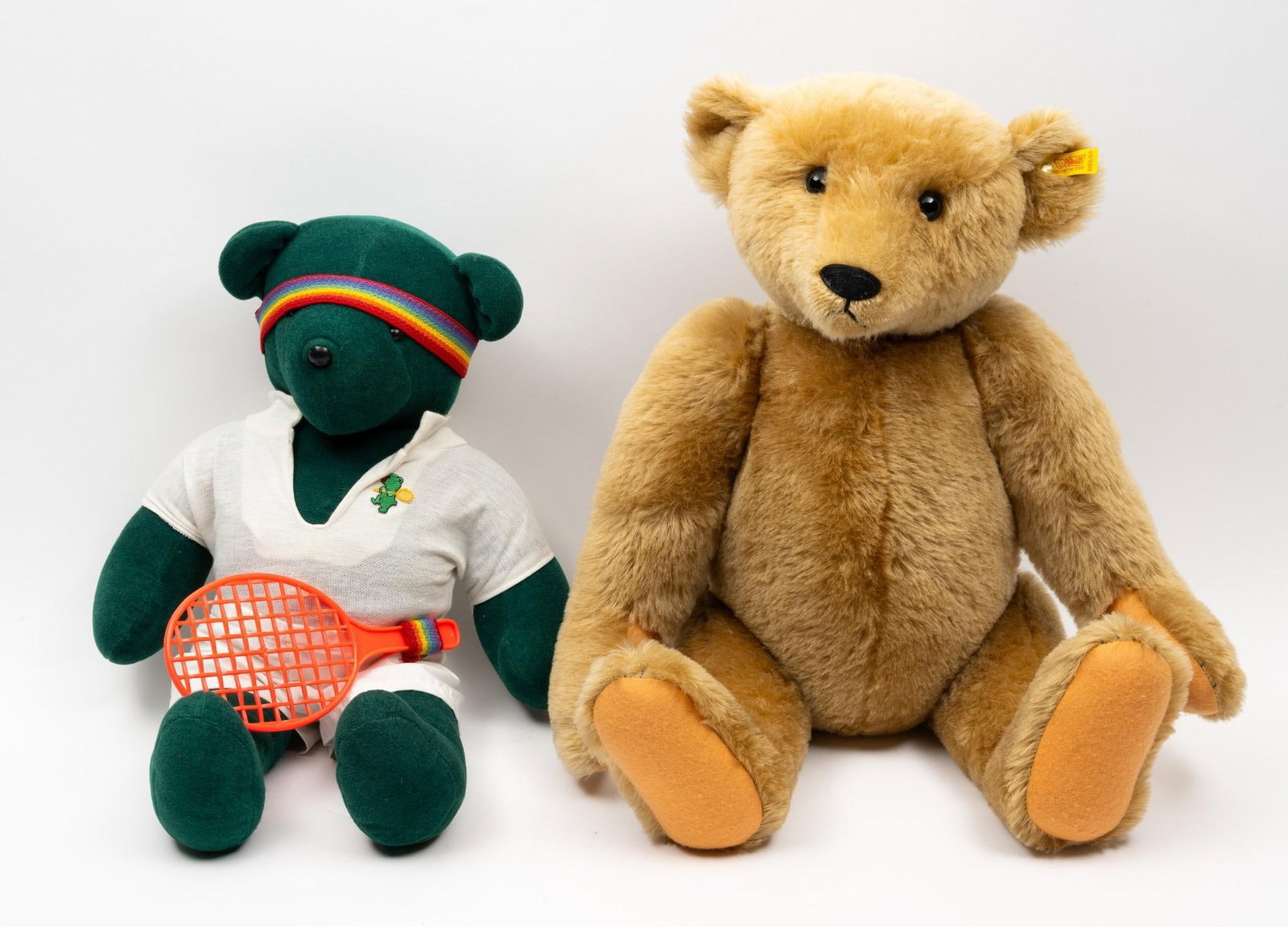 2 Bears incl Steiff: Steiff 0155/60 with ear tag. 25" high. North American Bear Co Inc tennis bear 21-1/2" high.