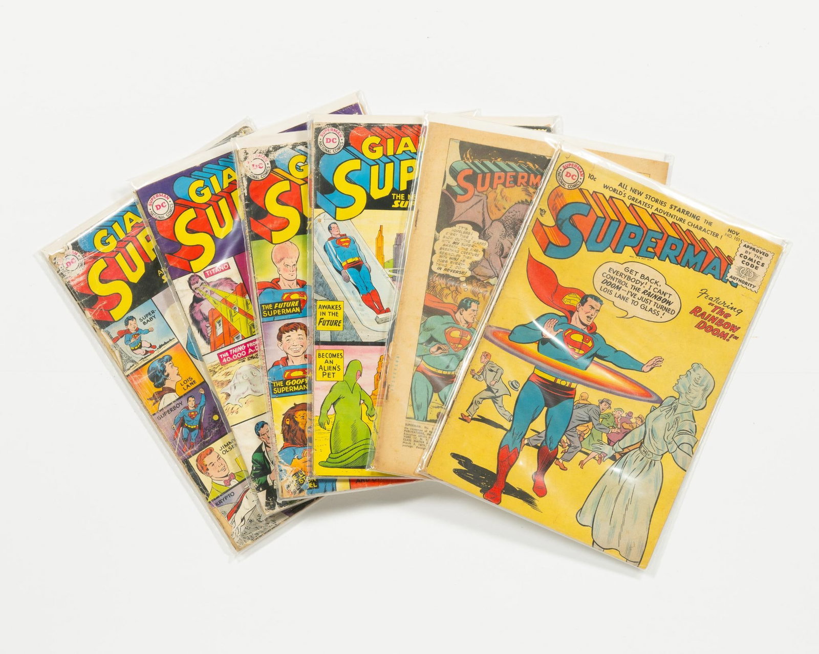 6 Superman Comics: 6 Superman comics. Golden and silver age comics. Includes issue 101 and Giant size 1-4. Average condition Poor/GD-.