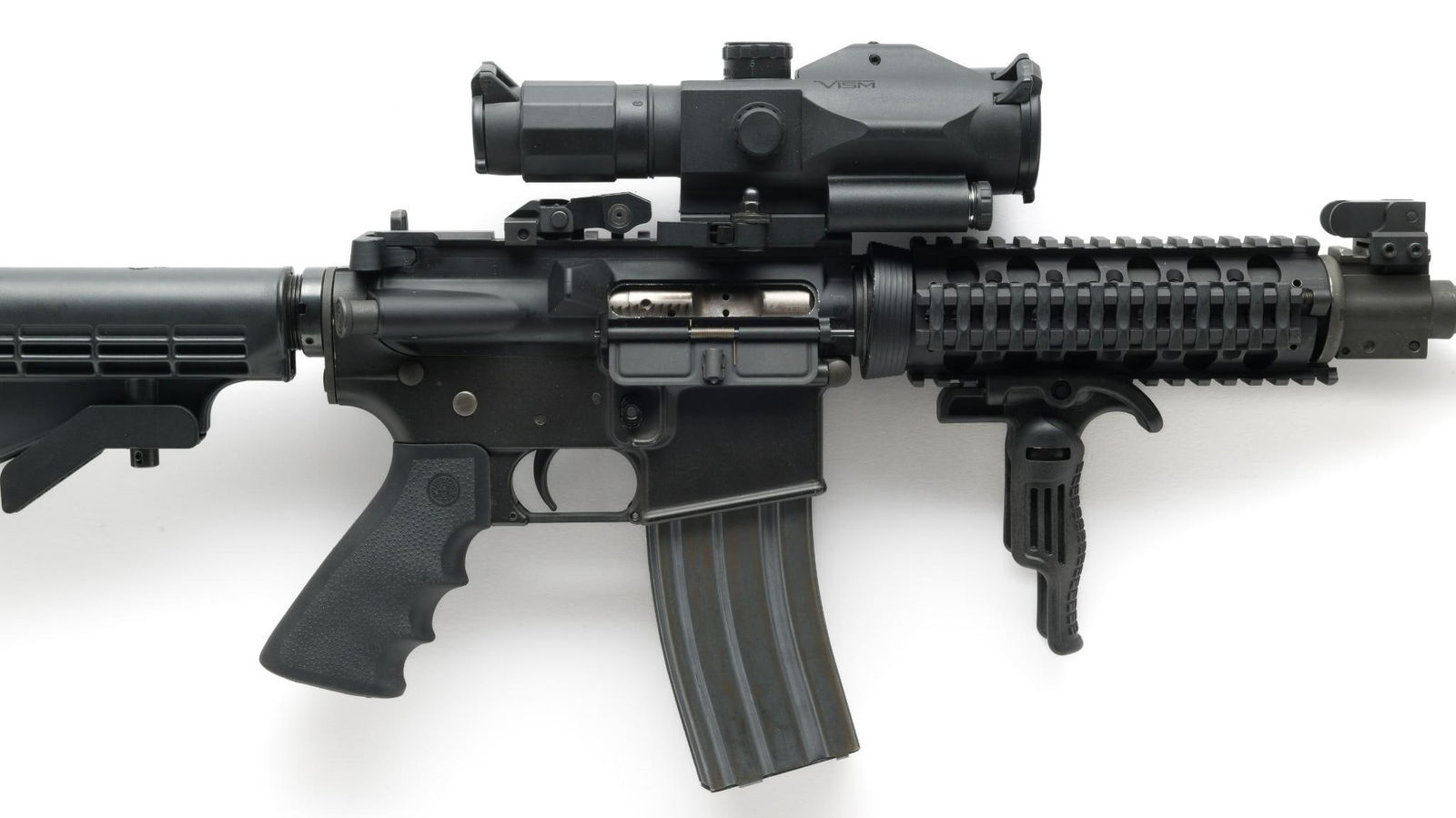 D.P.M.S. A-15 Semi Auto Rifle W/ Scope, Caliber .223: Serial Number: 1905 Design: D.P.M.S. of Becker, MN produced this AR-style semi auto rifle, caliber .223/5.56. Black overall. 18" barrel. Collapsible front grip and butt stock. This piece is now fitted