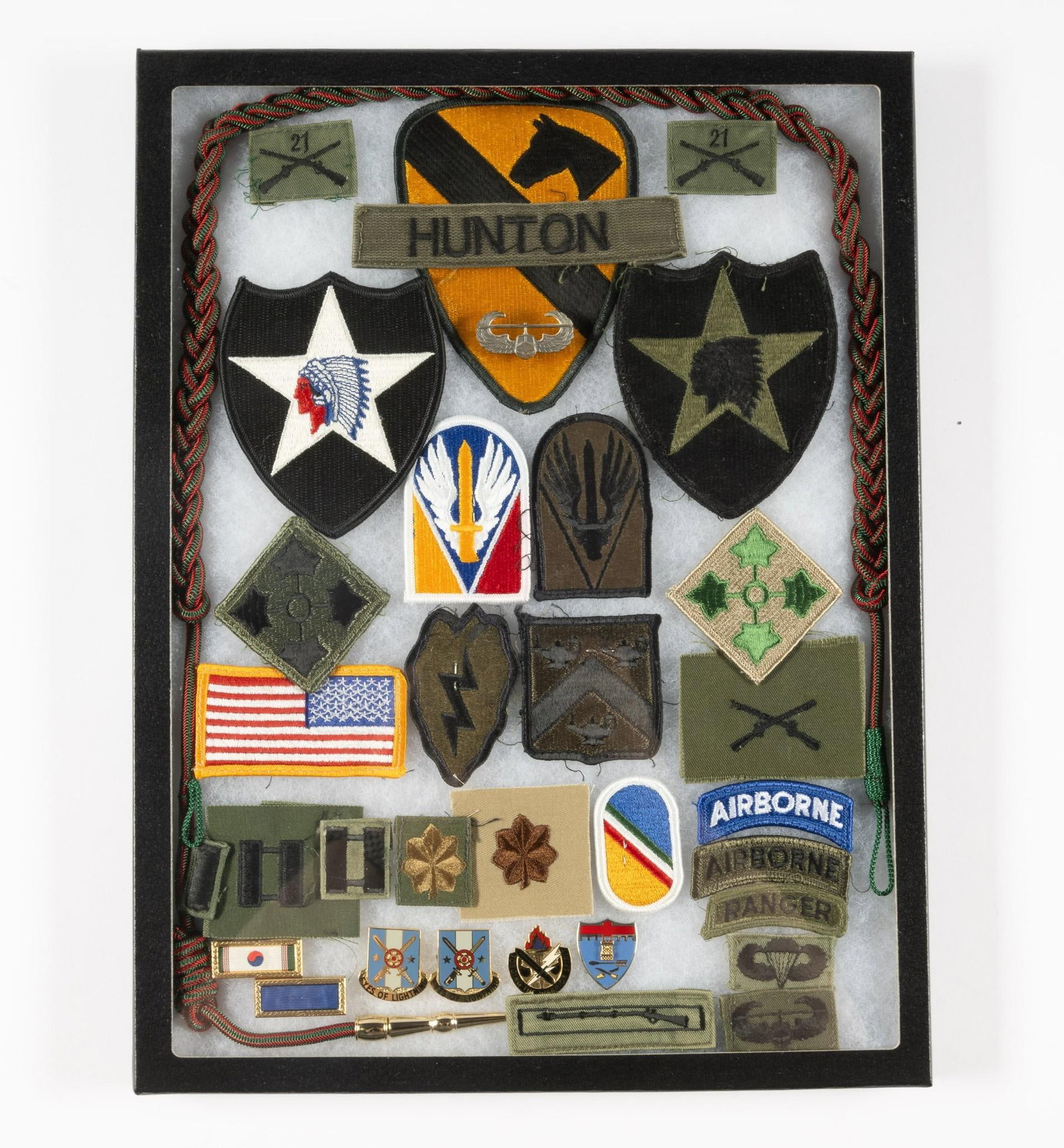 Collection of Airborne Ranger Insignia: Includes cord, patches, and pins. Ricker box is included.