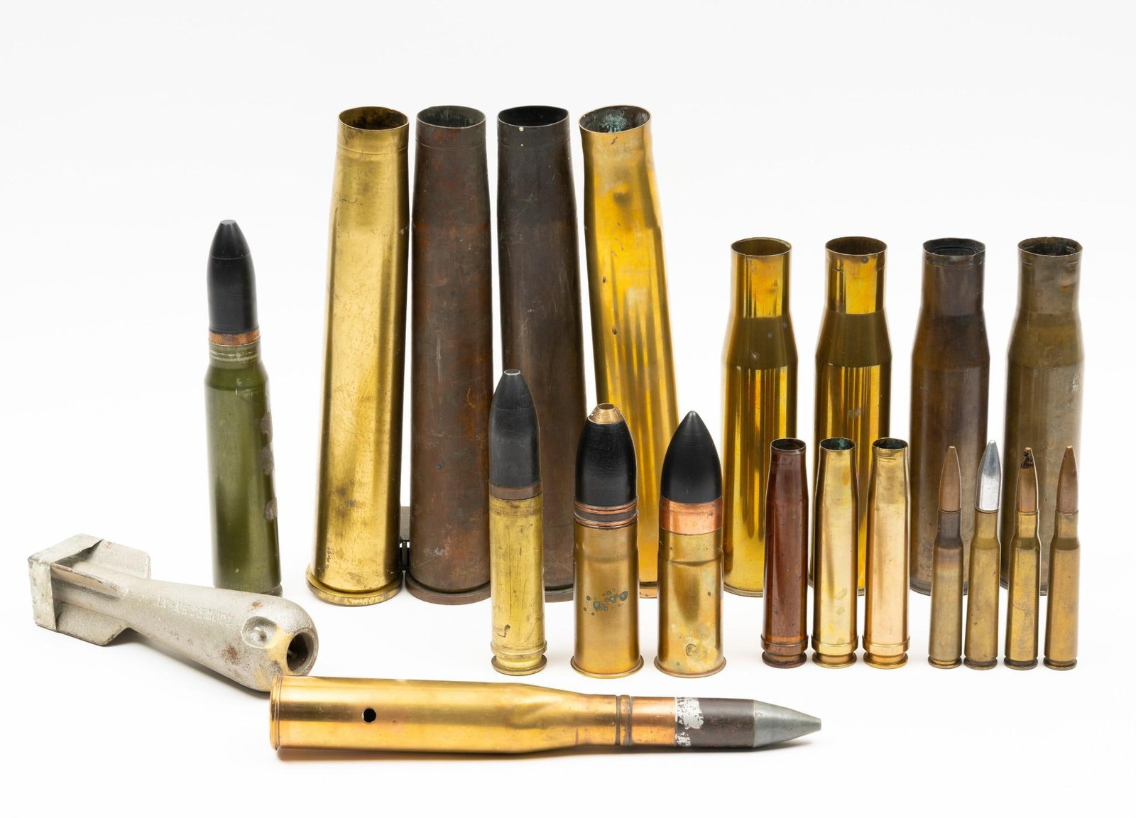 22 Artillery Shells: Includes (2) M17 Cases antiaircraft (1942); (2) M16 37mm brass cases; 30mm aircraft cannon; 37mm A.P. Projectile; 37mm H.E. Projectile; 30mm alum case; (3) German WWII 20 mm cases; U.S. Navy WWII 1" b