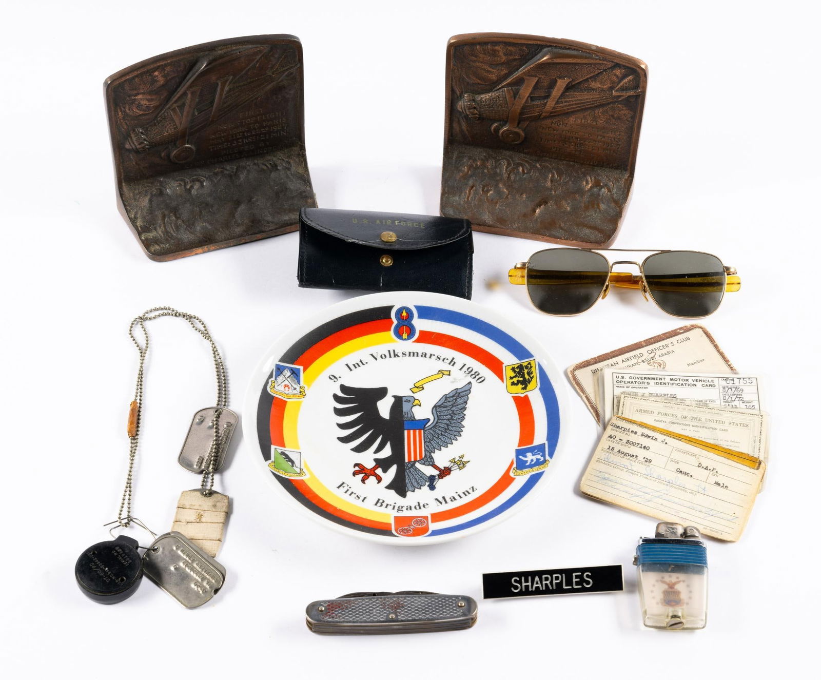 14 Pcs Military Memorabilia: Includes bookends, sunglasses, dog tags, and more.