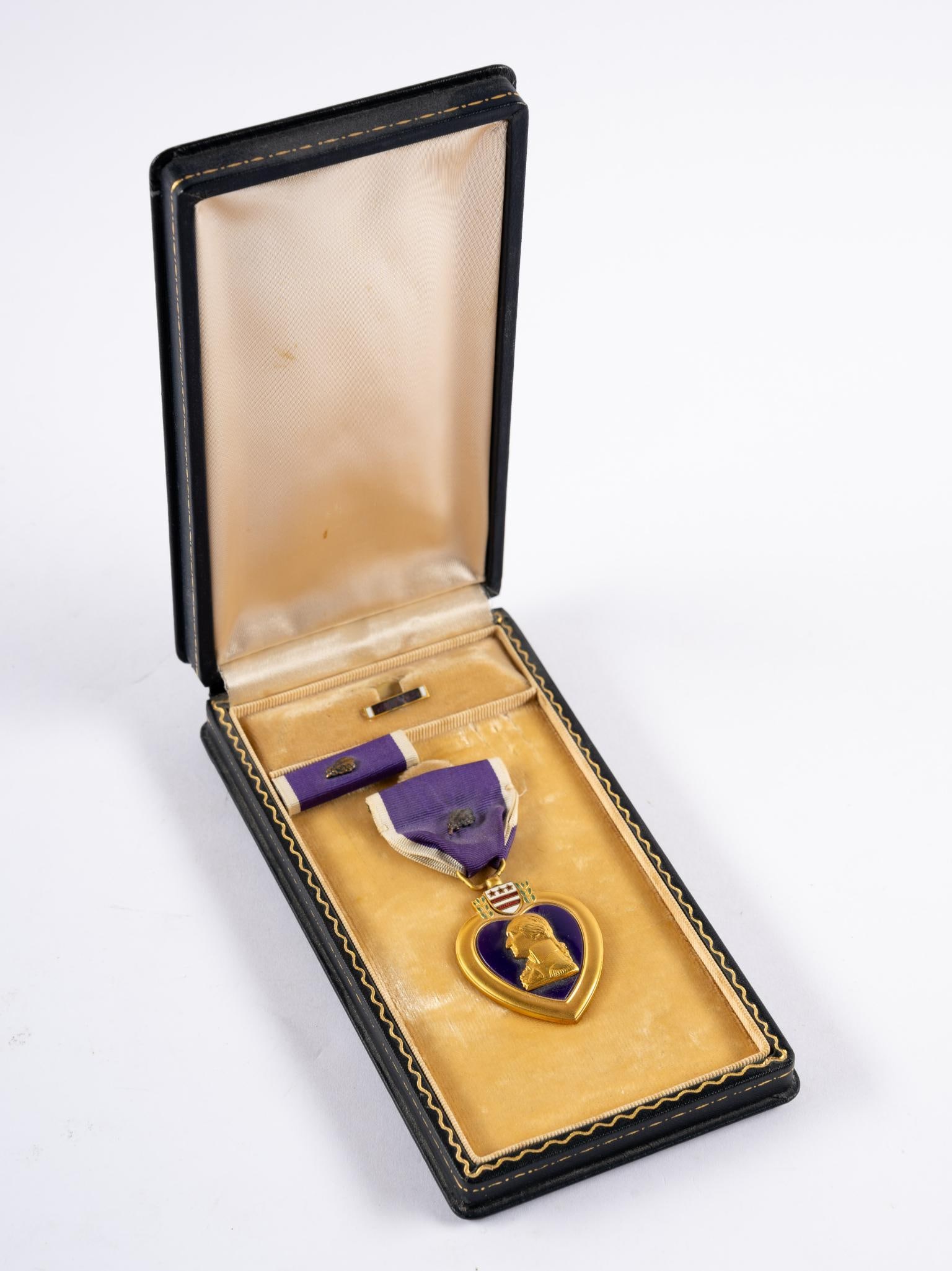 Purple Heart in OB: Engraved Harry J. Smith. Harry J. Smith was a Private in the Army during WWII. Part of the 29th Field Artillery Battalion, 4th Infantry Division. MIA pronounced dead June 6, 1944. Box measures 3-5/8" 