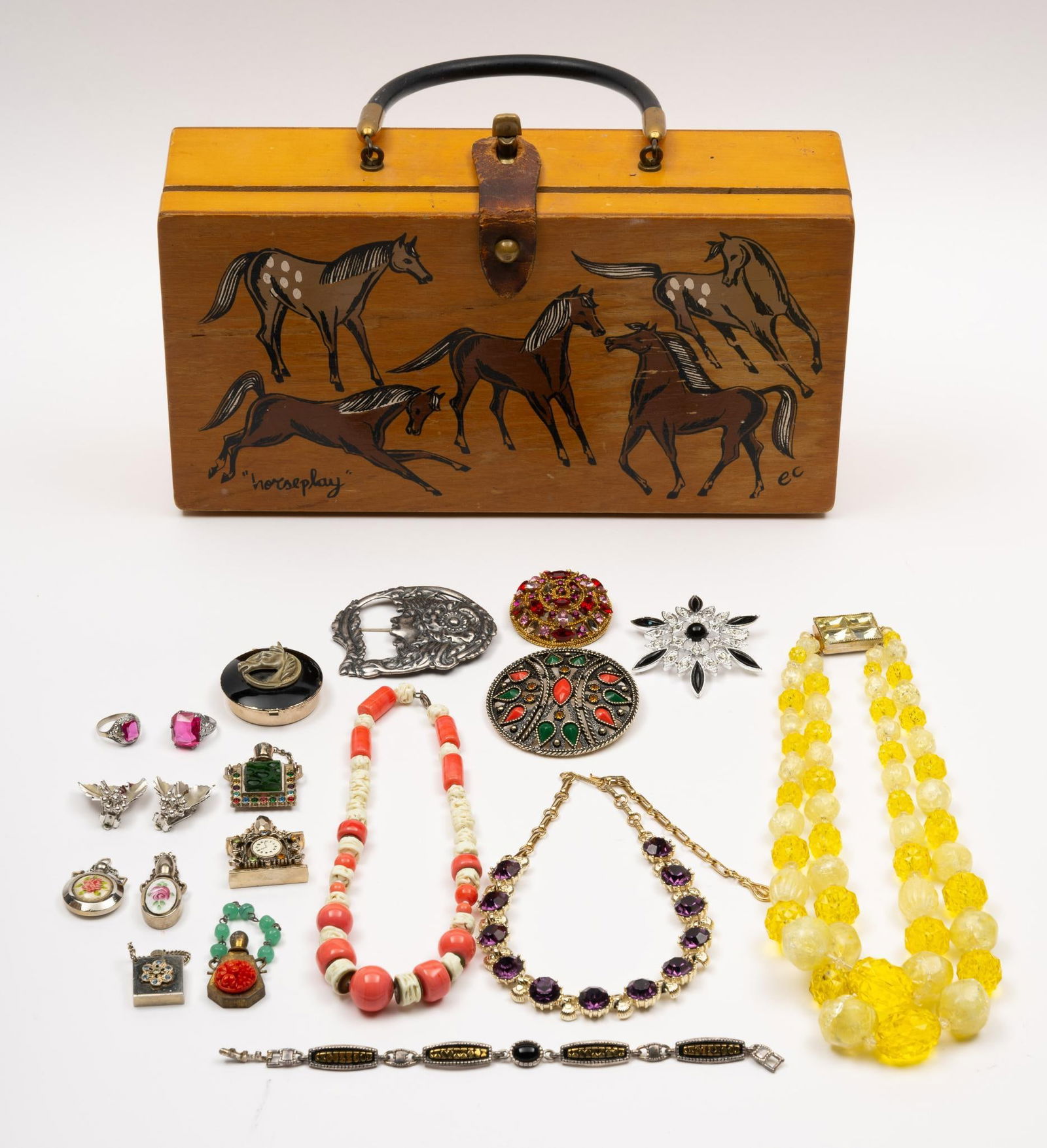 Grouping Vintage & Costume Jewelry: Includes Enid Collins "horseplay" mid-century box bag, 11-1/4" x 6" x 2-3/4". Coro rhinestone earrings, 3 brooches including Emmons and art nouveau, 2 silver rings with synthetic pink stones, horse co
