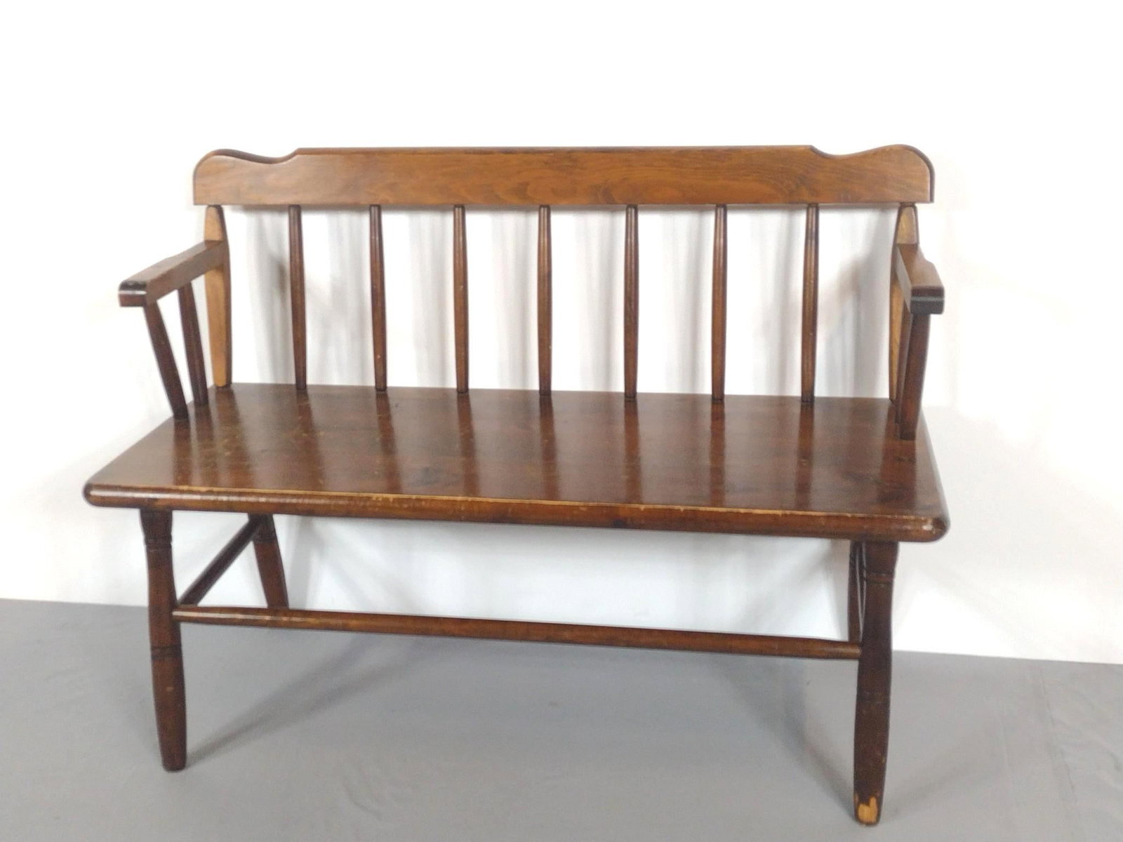 Bench with Armrests: NOT ELIGIBLE FOR IN-HOUSE SHIPPING. 44" wide X 17-1/2" deep X 32-1/2" high. Bench top has scratches. Front leg has finish loss.