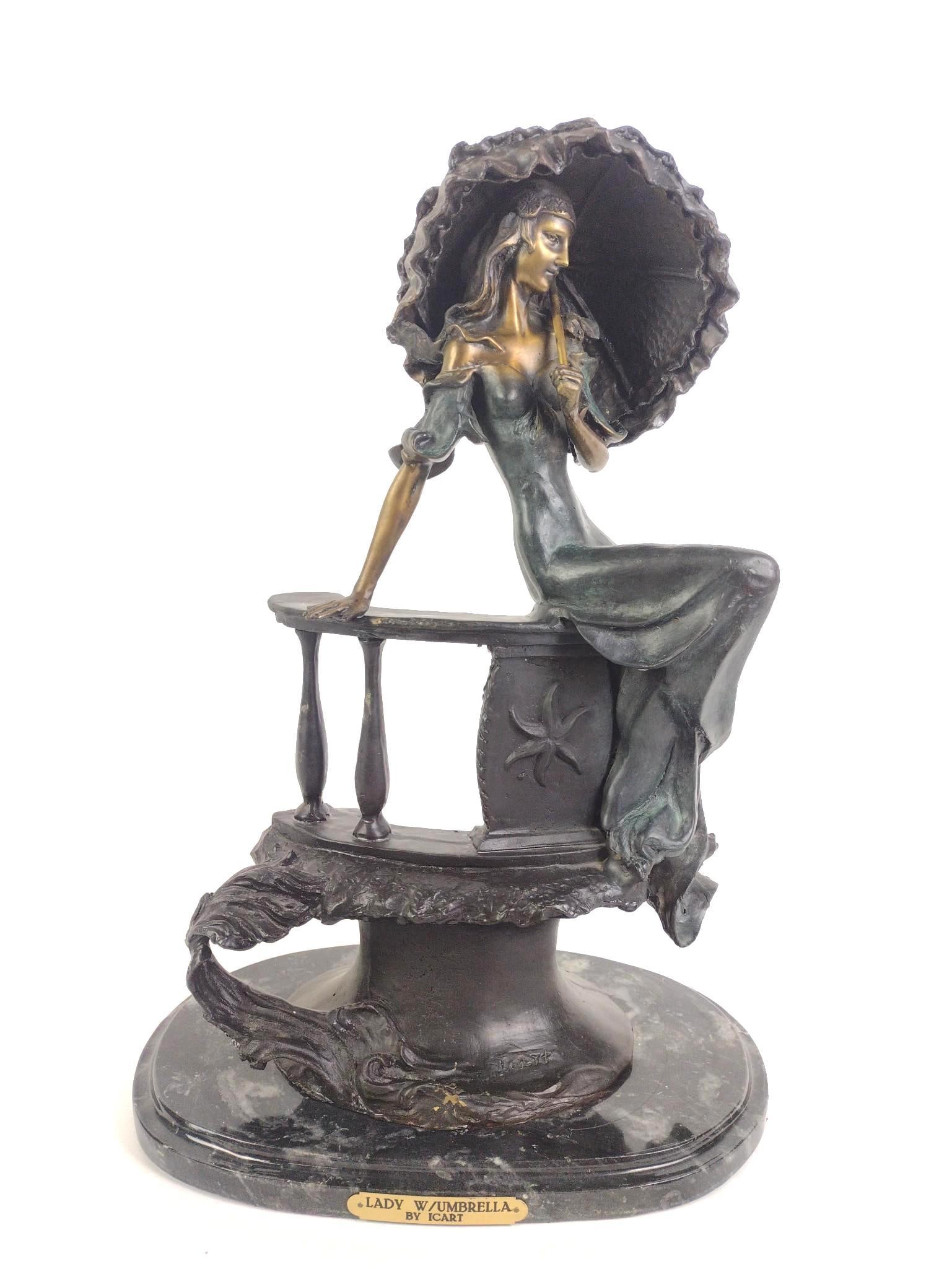 After Louis Icart “Lady with Umbrella" Bronze: NOT ELIGIBLE FOR IN-HOUSE SHIPPING. Louis Justin Laurent Icart (1888 - 1950) was active/lived in New York / France. Louis Icart is known for sensuous female figure drawing and painting, fashion design