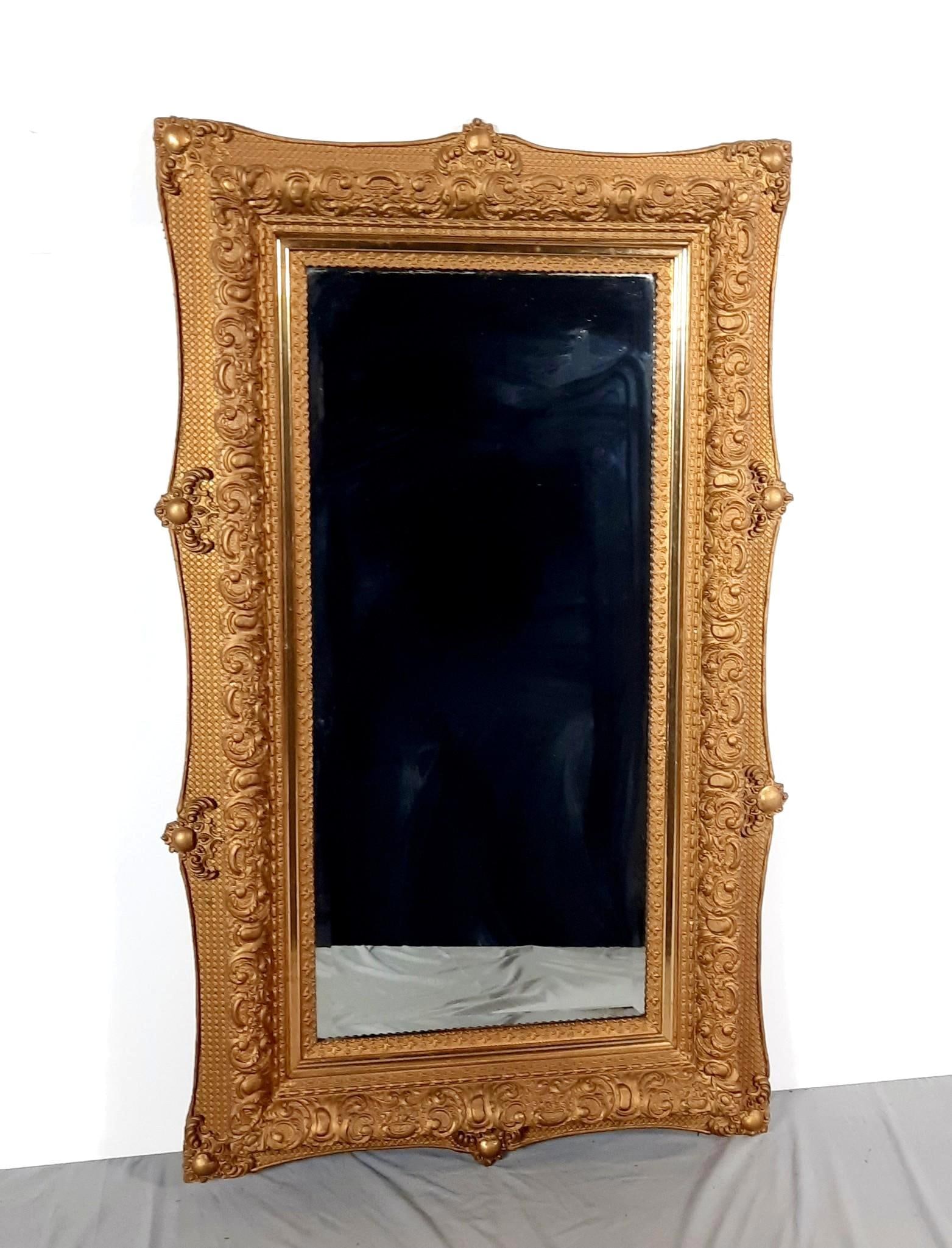 Antique Gilt Mirror with Beveled Glass: NOT ELIGIBLE FOR IN-HOUSE SHIPPING. Overall with frame 54-1/4" high x 31-1/2" wide. Minor wear to frame.