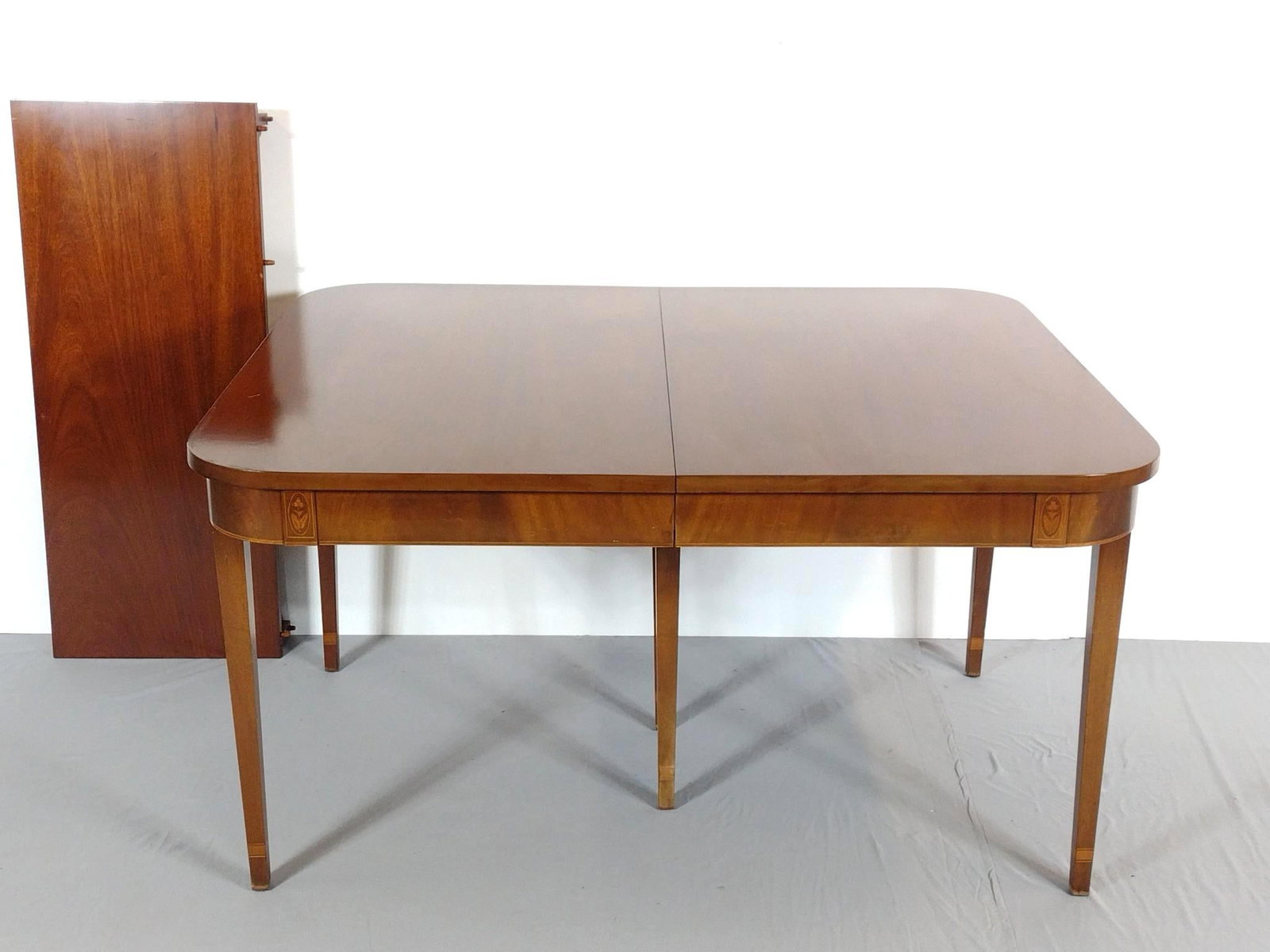 Biggs Dining Table With 2 Leaves: NOT ELIGIBLE FOR IN-HOUSE SHIPPING. Table 54" wide X 44" deep X 30-1/4" high. Leaves each 18" wide. Table has some light scratches.
