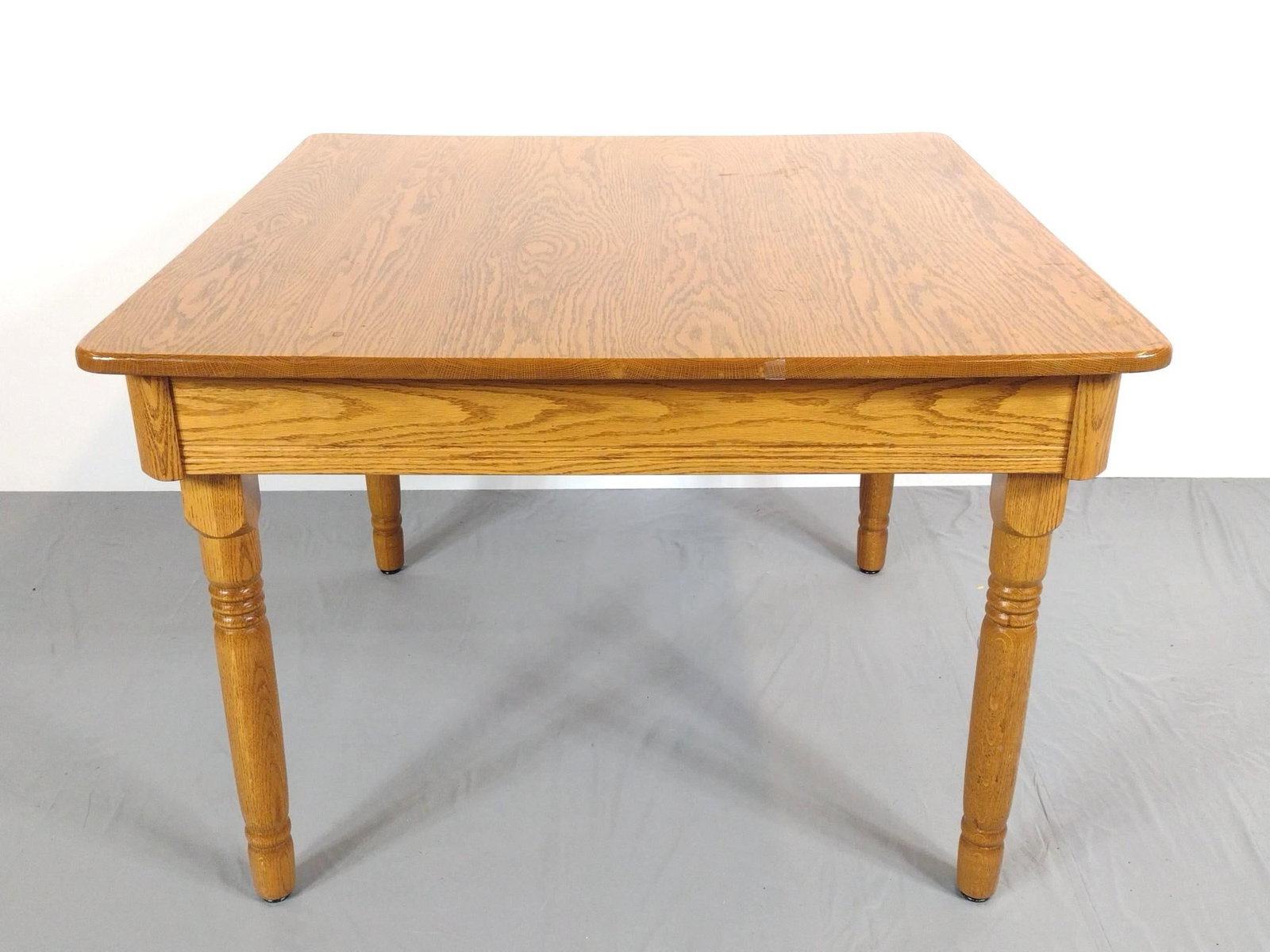 Oak Dining Table: NOT ELIGIBLE FOR IN-HOUSE SHIPPING. 41" wide X 42" deep X 30" high. Has a few scratches.