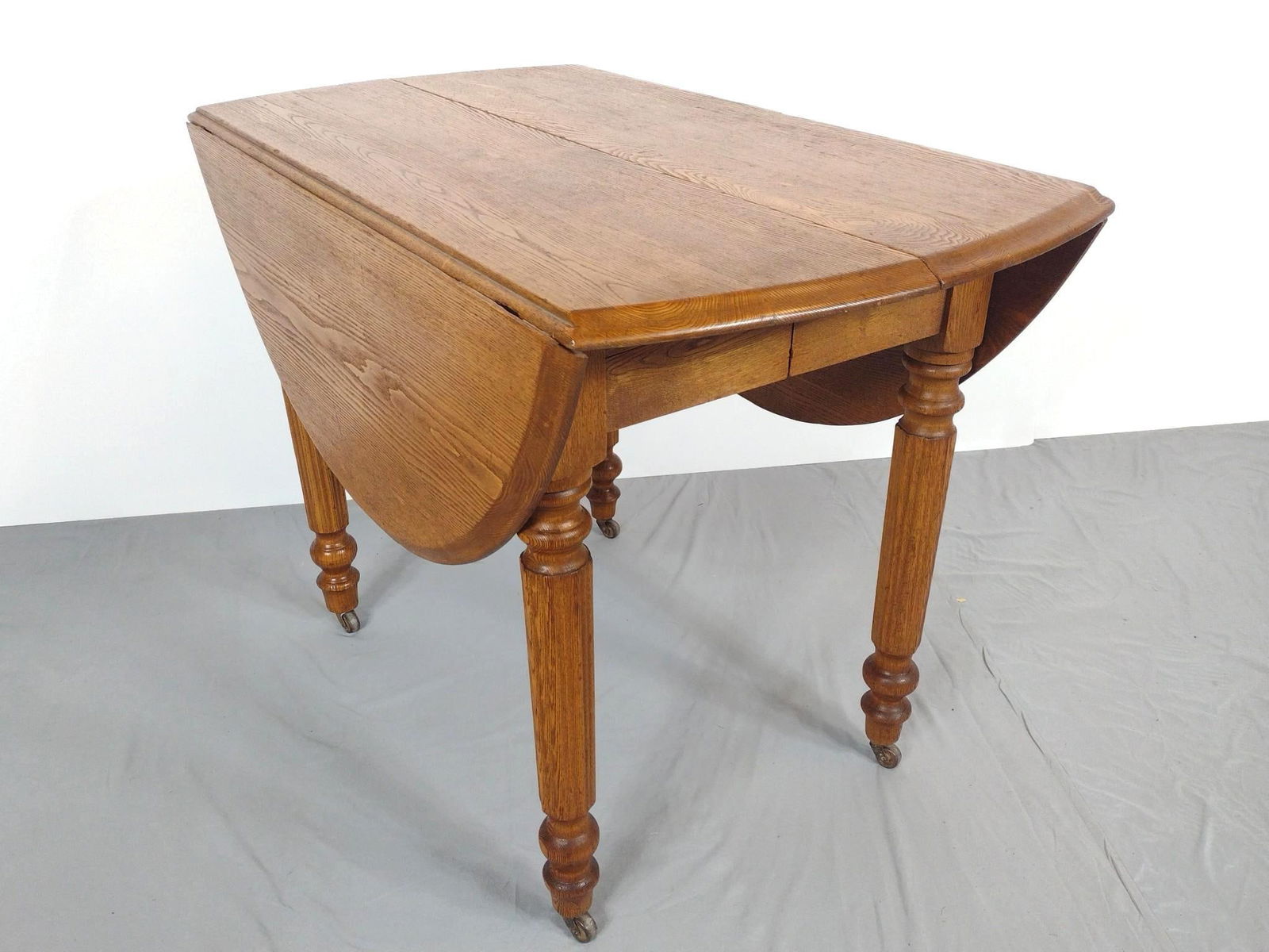 Drop Leaf Table: NOT ELIGIBLE FOR IN-HOUSE SHIPPING. Open 49-1/2", closed 22-1/2" wide X 40-1/2" deep X 29" high. Has some light scratches.