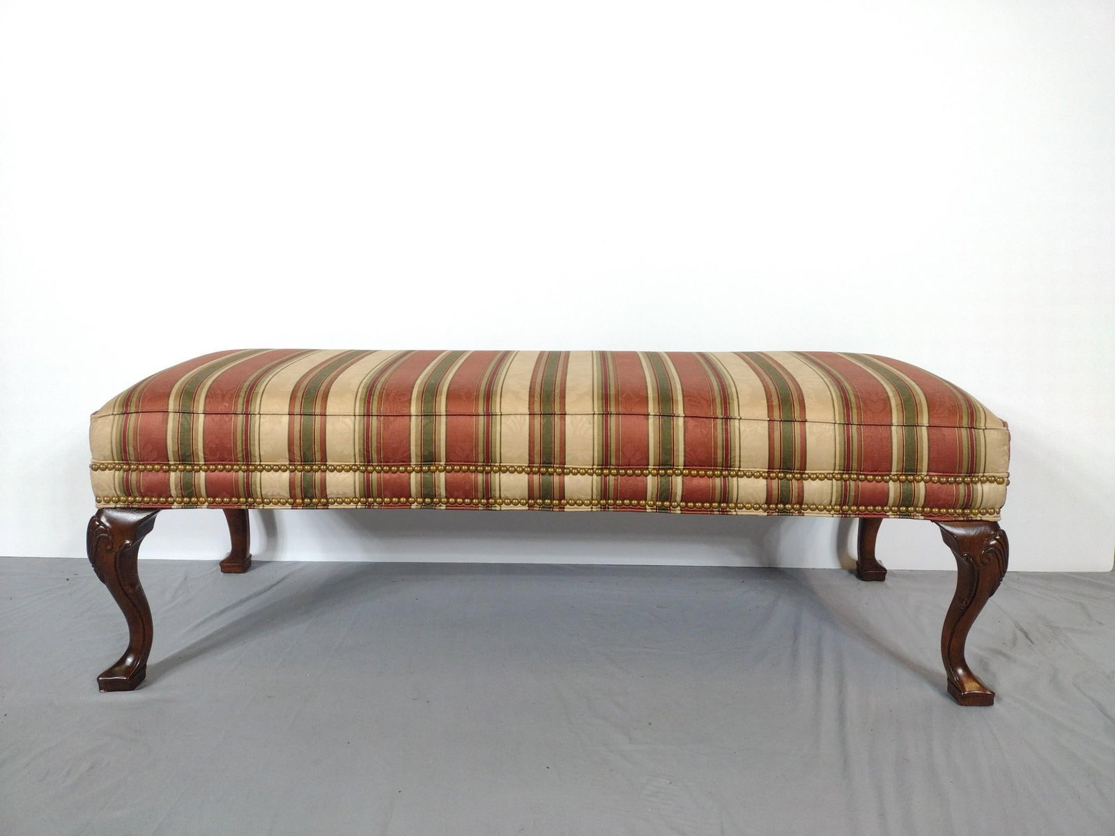 Upholstered Bench: NOT ELIGIBLE FOR IN-HOUSE SHIPPING. 53" wide X 19" deep X 19" high. No manufactures name found.