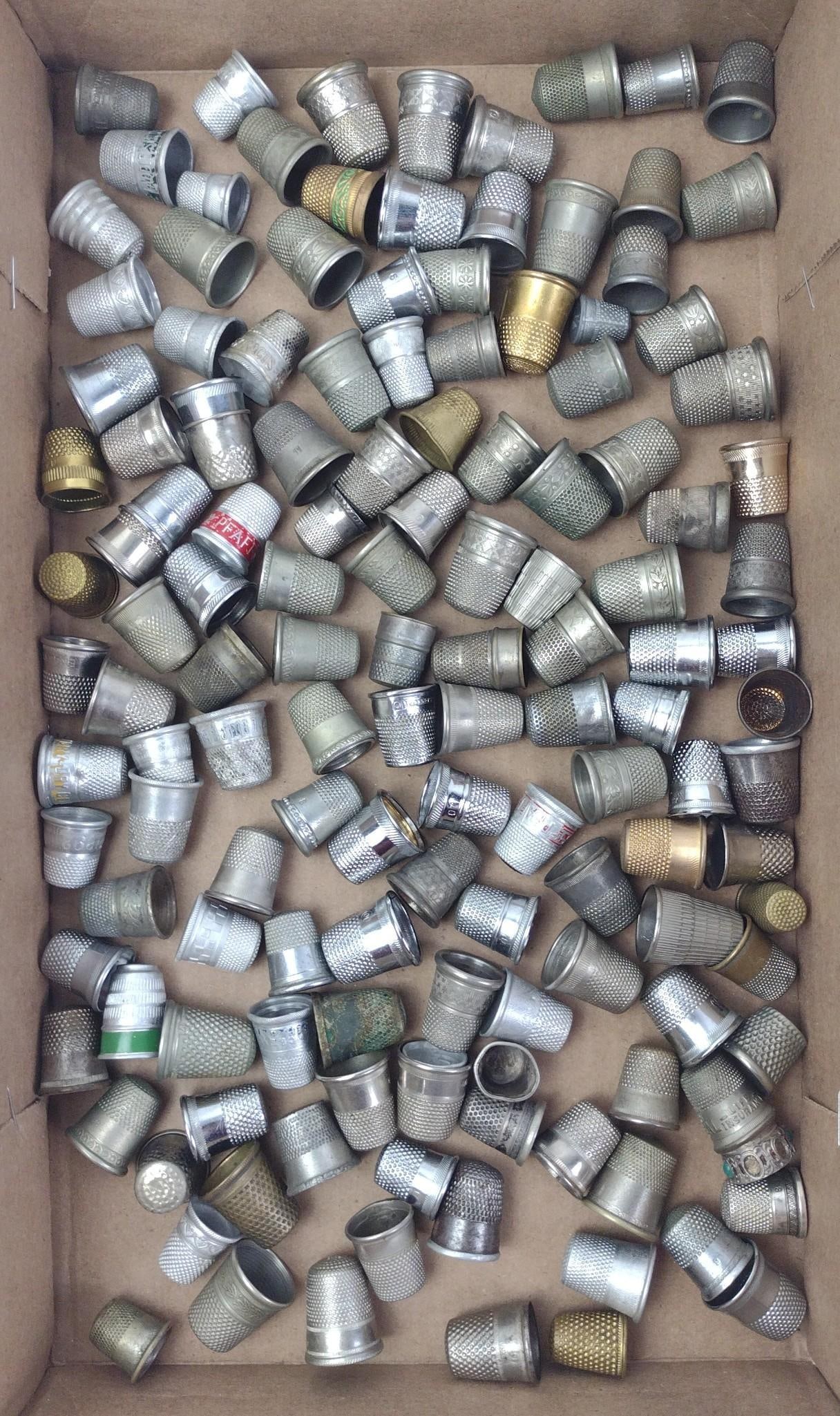 138 Thimbles: Various metals and sizes. Includes England, Germany, Taiwan and others.