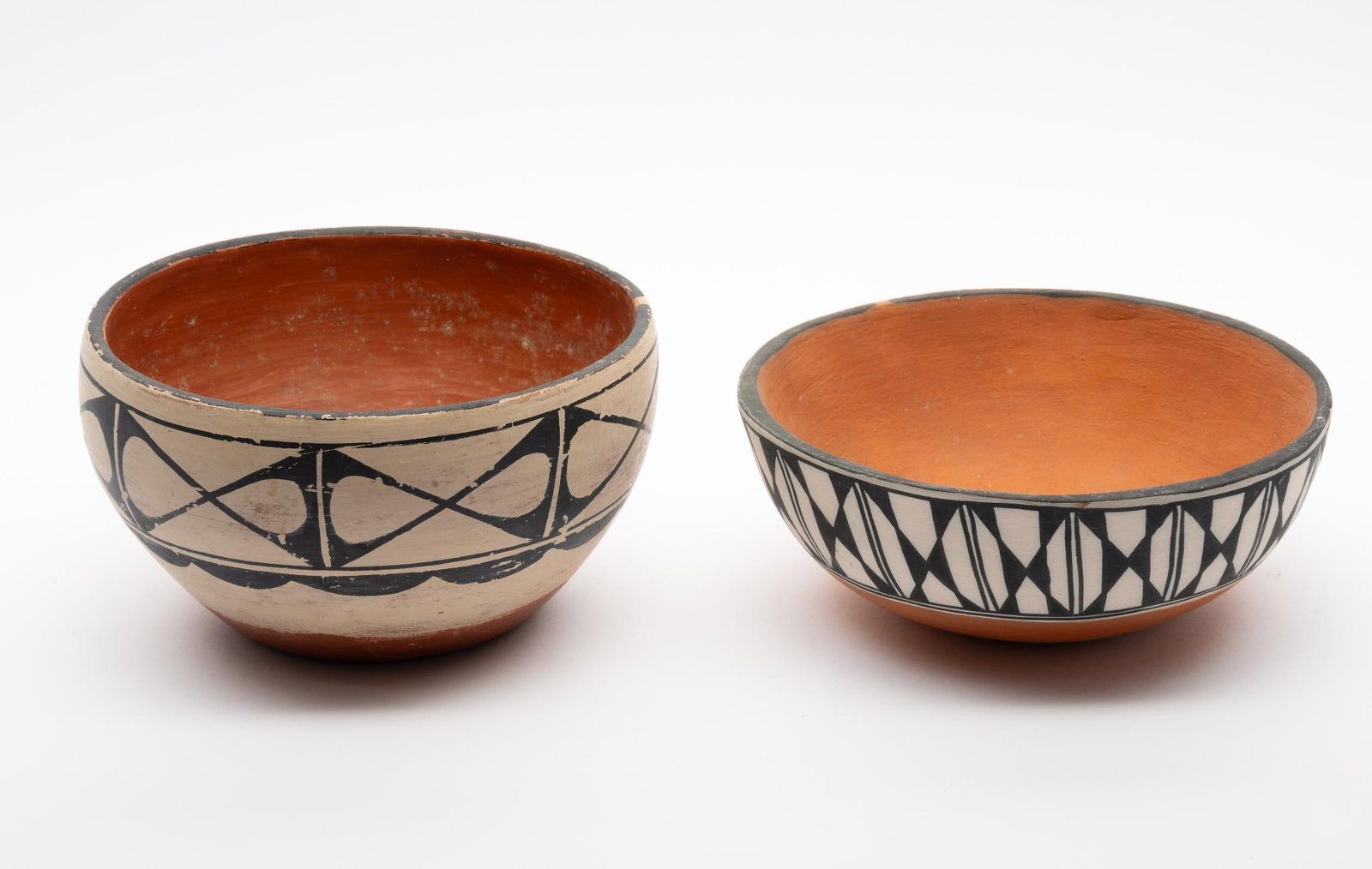 Two Santo Domingo Dough Bowls: Two dough bowls made by Santo Domingo Pueblo potters. The first signed Imo and Marie Aguilar (the latter of the celebrated Aguilar family of potters). The second signed Lita Wagner and dated 1987. Mea