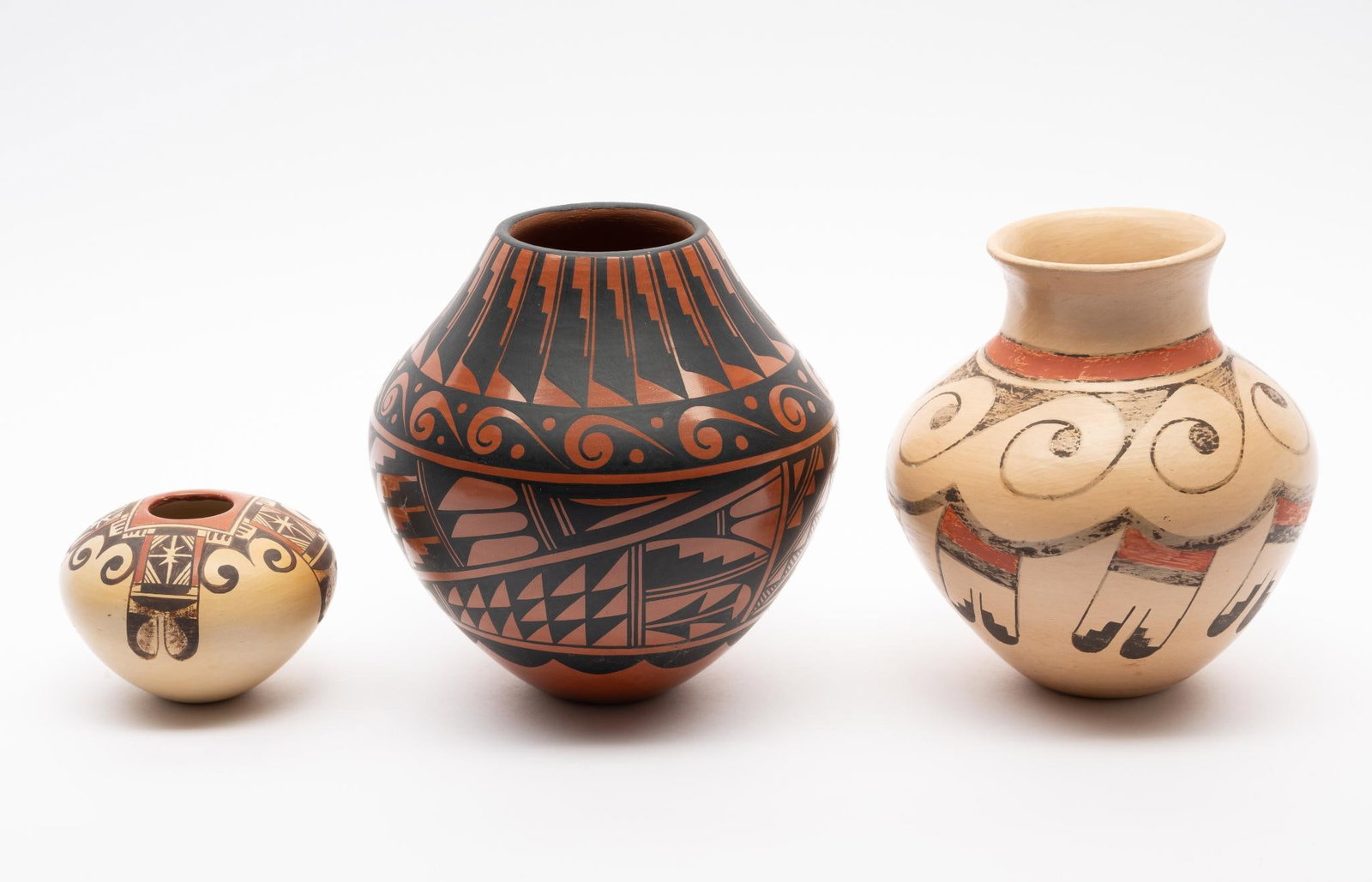 Three Hopi Pots including Second Frog Woman: Three Hopi pots dating from the second half of the 20th century. The first a beautifully decorated low jar marked by Adelle Nampeyo (1975-) a grand-daughter of Nampeyo of Hano. The second a superb lar
