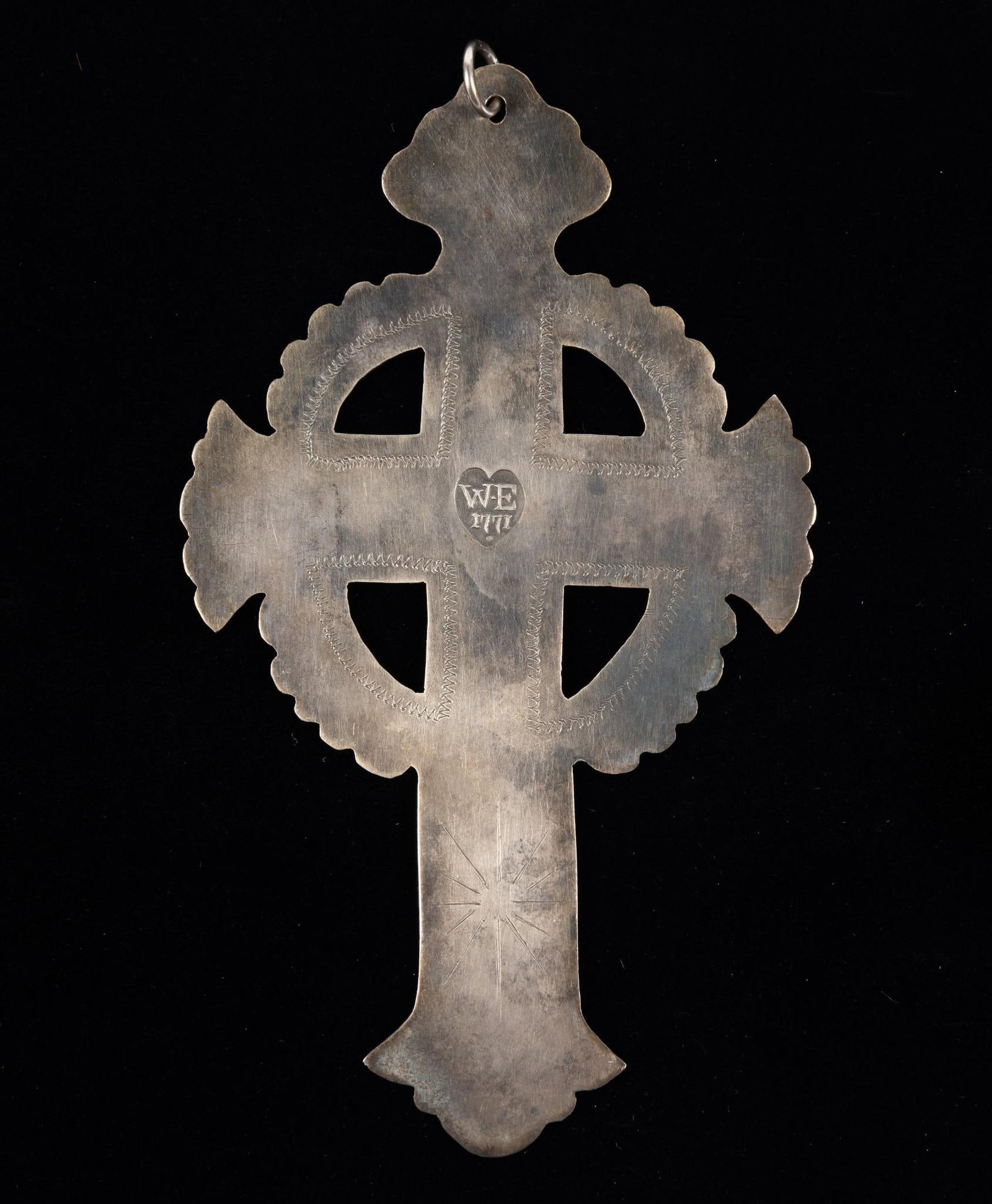 Indian Trade Silver Cross: A large Indian trade silver cross with top radiate. Marked Marked "W.E. 1771." Trade silver marked WE is generally thought to be by William Evens (1761-1774) although most references show his mark ins