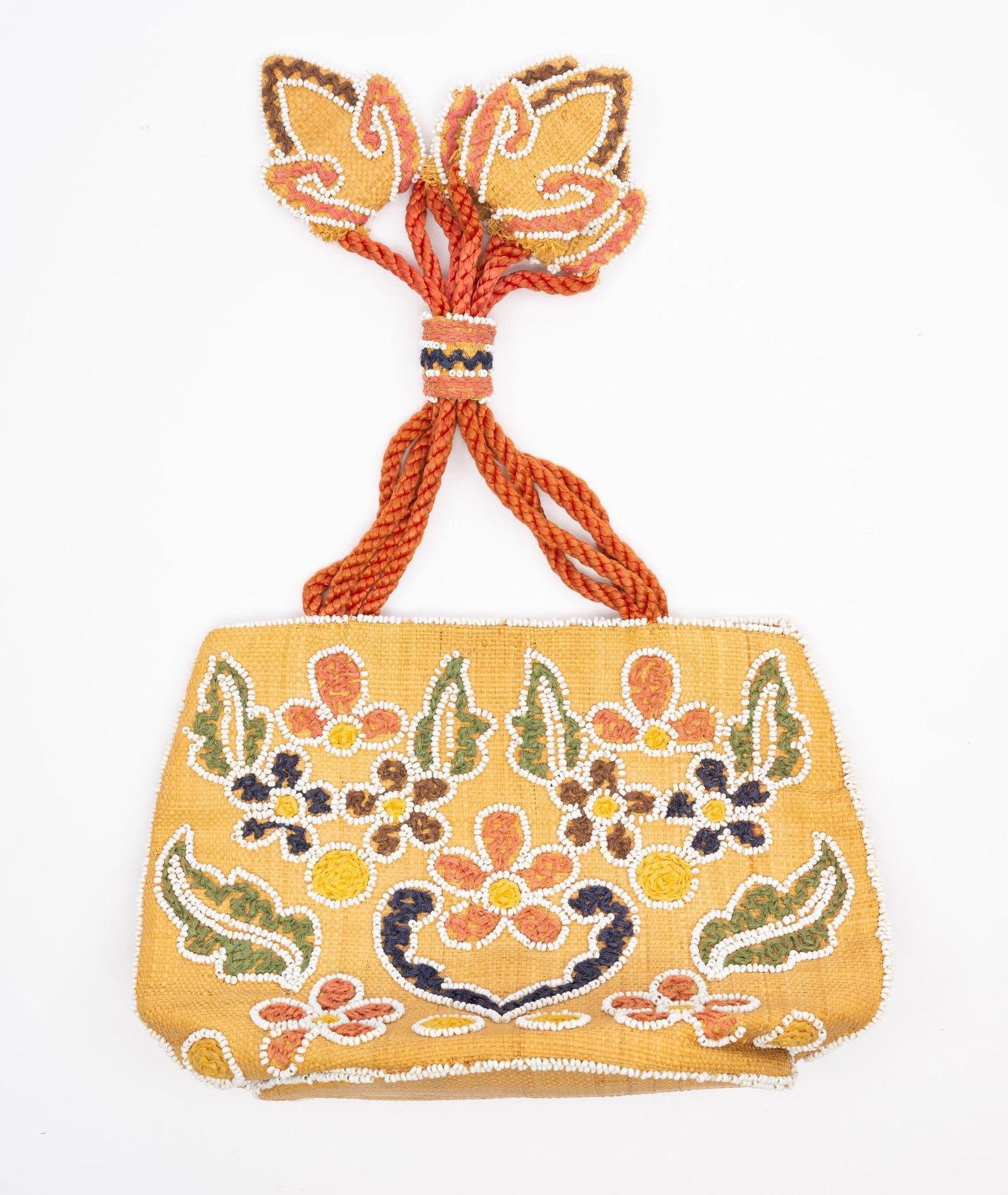 Beaded Bag Attributed to Cree or Athabaskan: A lovely hide back with floral beadwork and an unusual hanging strap. Probably late 19th or early 20th century and meant to hold sewing implements in a house. Measurement: 8-1/4" x 13". Condition: Som