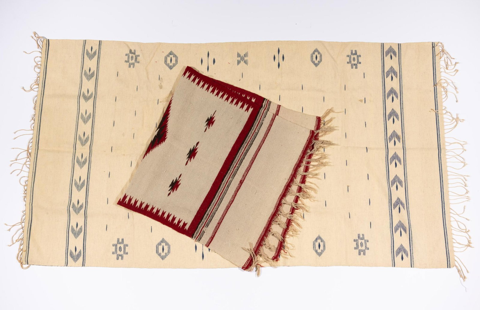2 Hispanic Southwest Weavings: Two Hispanic southwestern United States weavings. The first a fine and uncommon blue on white weaving. The second a smaller and more traditional Chimayo type weaving. Measurements: Runner 61" x 27". R