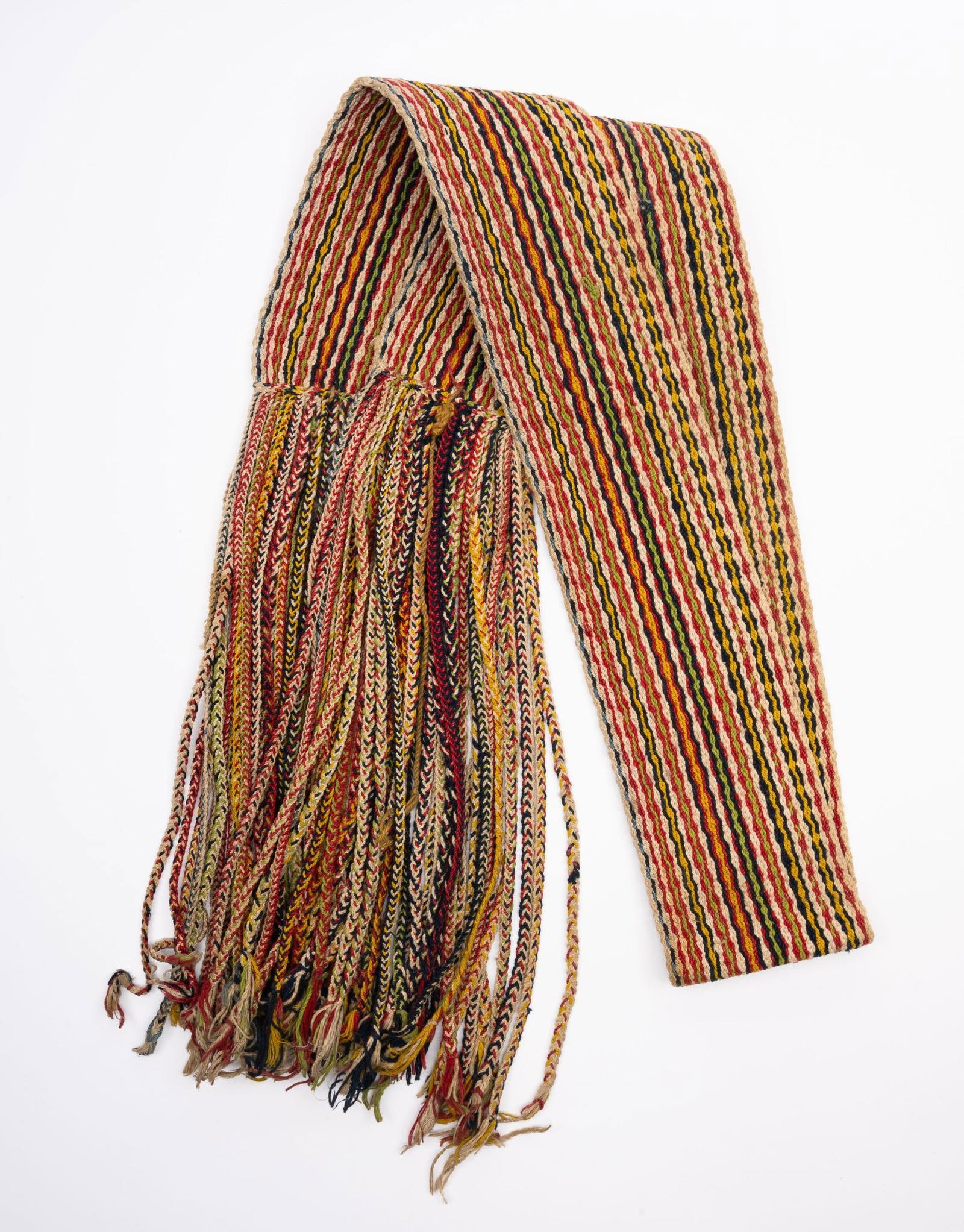 Apache Dance Sash: A lovely and uncommon western Apache dance sash probably early to mid 20th century. Measurements: 3-3/4" wide x 80" long. Provenance: Bought from Legare Auction, New Hampshire in August, 2005. Conditi